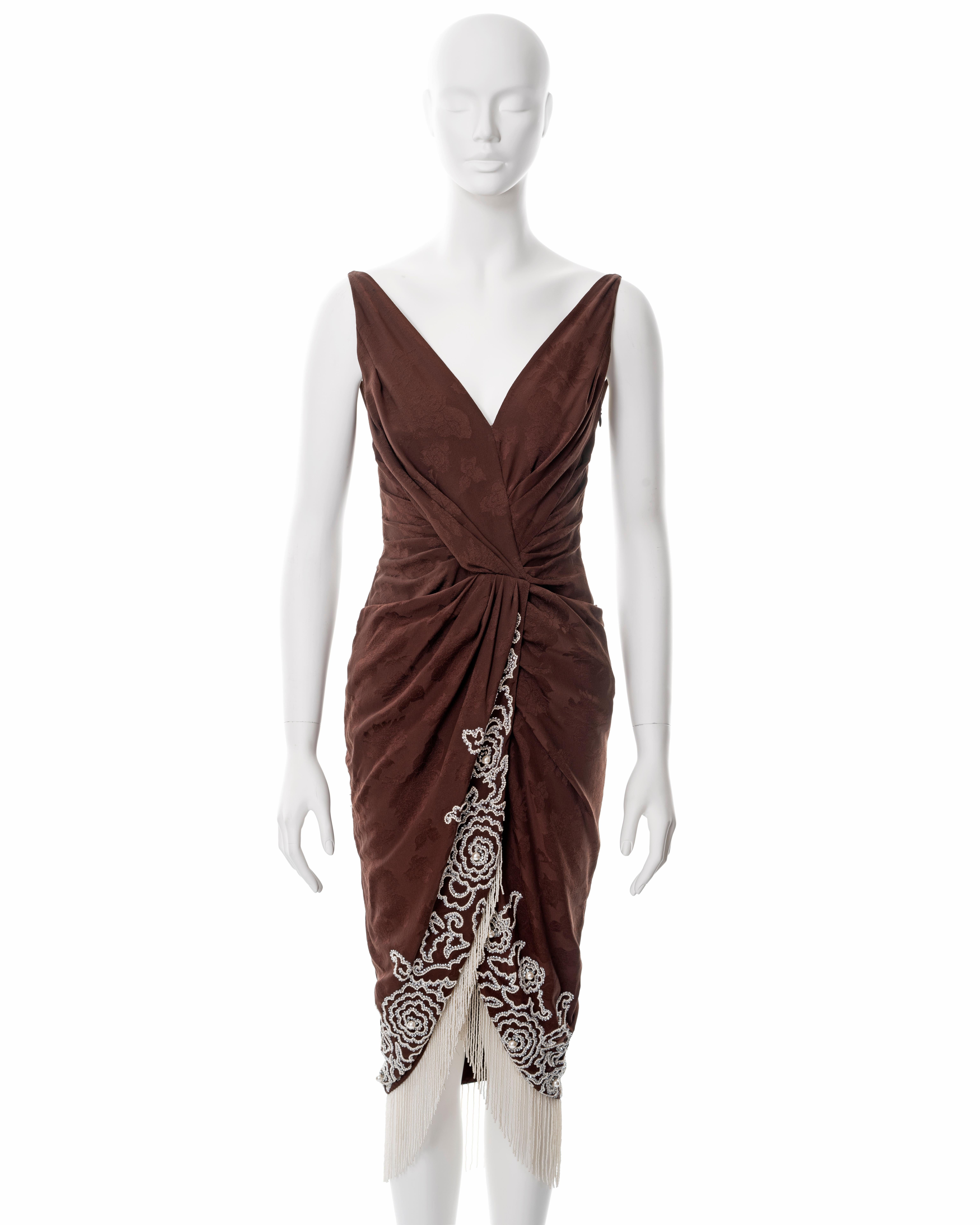 ▪ Christian Dior cocktail dress
▪ Designed by John Galliano
▪ Sold by One of a Kind Archive
▪ Spring-Summer 2008
▪ Constructed from brown silk jacquard 
▪ Beaded and fringed with faux pearls 
▪ Draped bodice and skirt 
▪ FR 36 - UK 8 - US 4
▪ Made