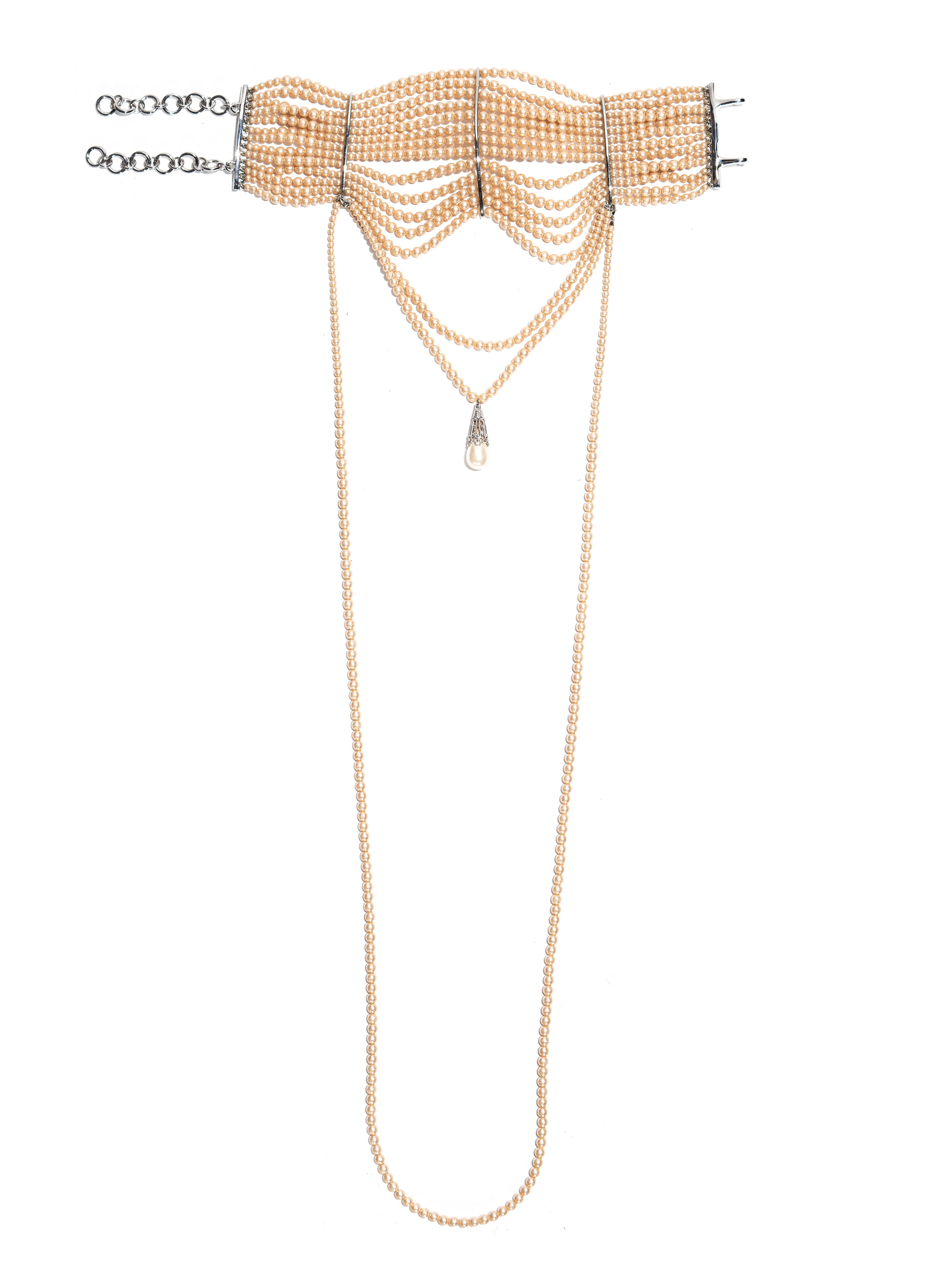▪ Christian Dior faux pearl choker necklace  
▪ Designed by John Galliano  
▪ 16-strands of faux pearls
▪ Large pendent set in metal hangs at the center   
▪ Polished silver metal hardware  
▪ 2 adjustable chain closures at the back  
▪