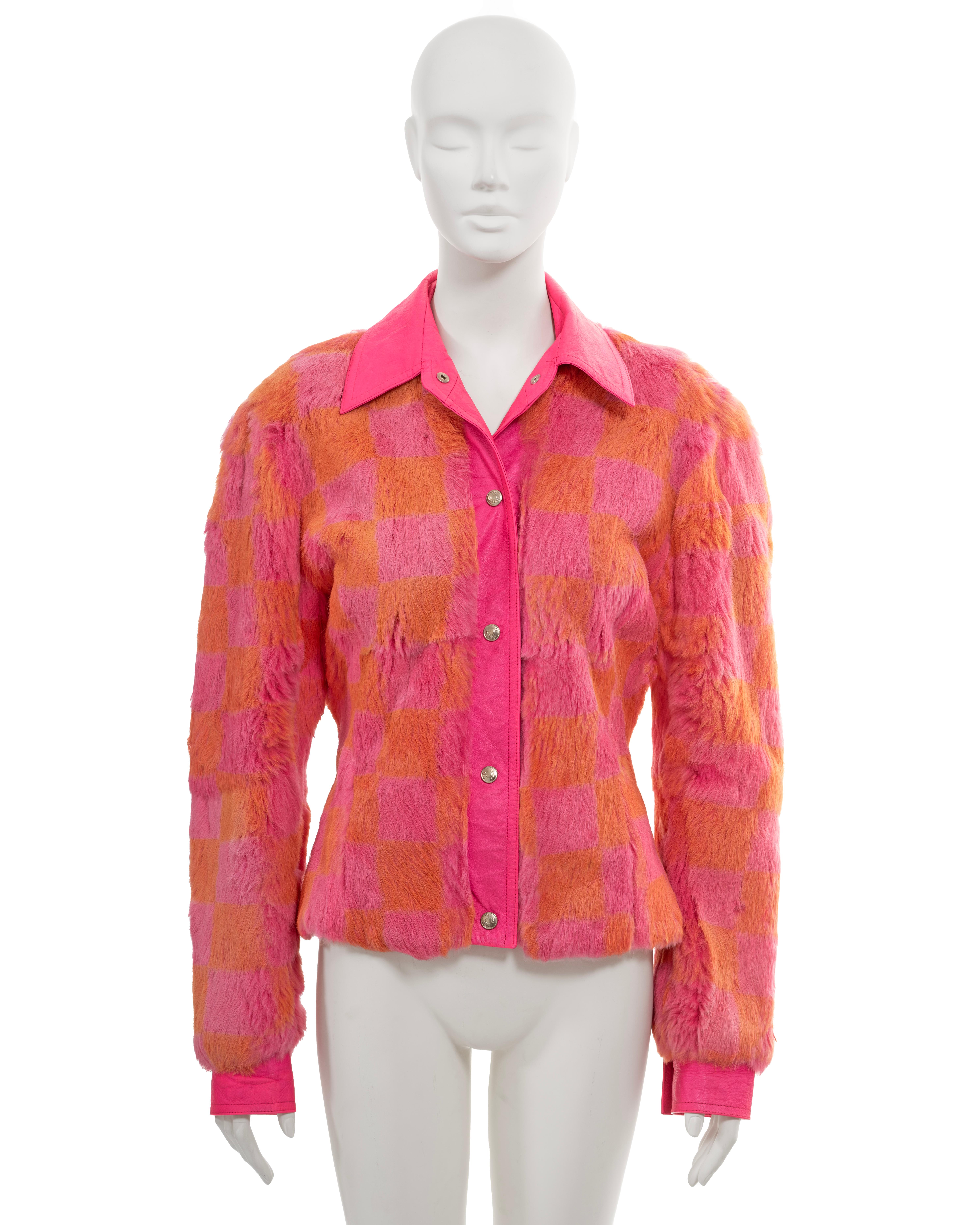 ▪ Christian Dior fur shirt jacket
▪ Creative Director: John Galliano
▪ Fall-Winter 2001
▪ Sold by One of a Kind Archive
▪ Rabbit fur, meticulously dyed in a pink and orange checkerboard print
▪ Accentuated with highlighter-pink leather trim
▪ Silver