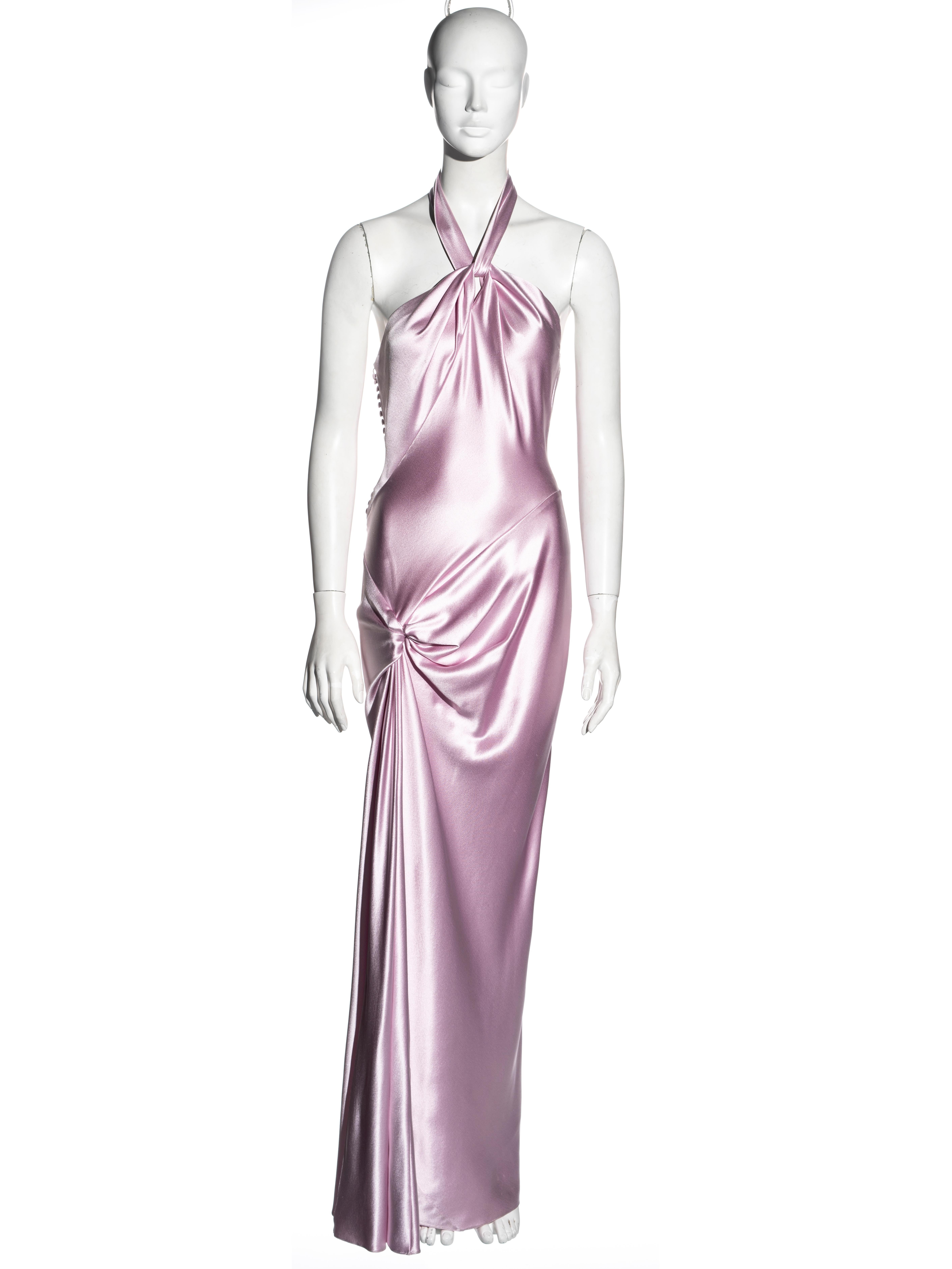 ▪ Christian Dior evening dress
▪ Designed by John Galliano
▪ Charmeuse pure silk in cherry blossom pink
▪ Bias-cut
▪ Halter-neck
▪ Knot detail at the hip
▪ High leg slit 
▪ Multiple fabric buttons
▪ FR 40 - UK 12 - US 8
▪ Fall-Winter 2003
▪ 100%