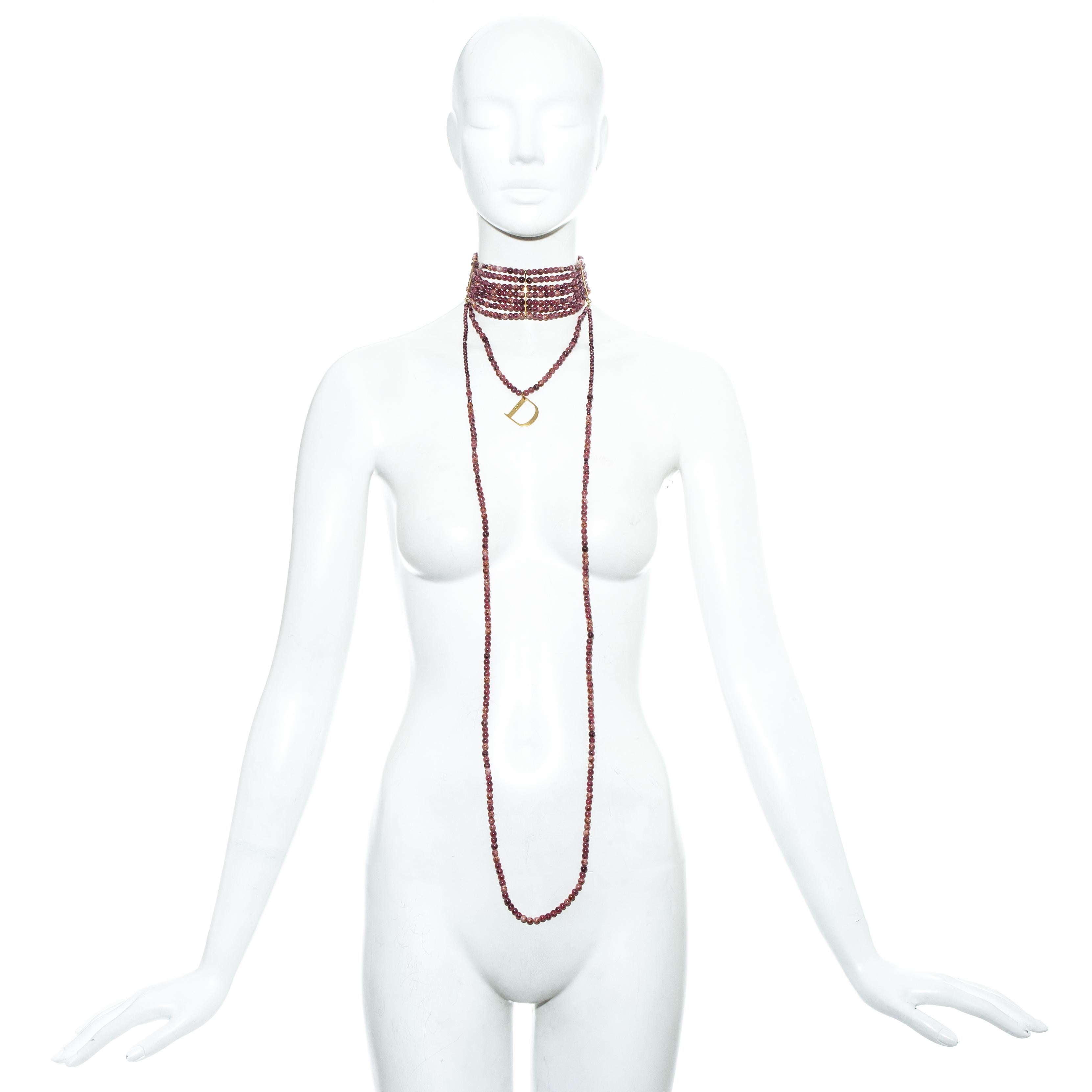Christian Dior by John Galliano; Pink marble glass bead Maasai choker necklace

- 7 beaded stands
- 2 long beaded strands, which can be wrapped around twice to shorten length
- Signature gold Dior 'D' pendent
- 3 gold metal bands which sculpt the