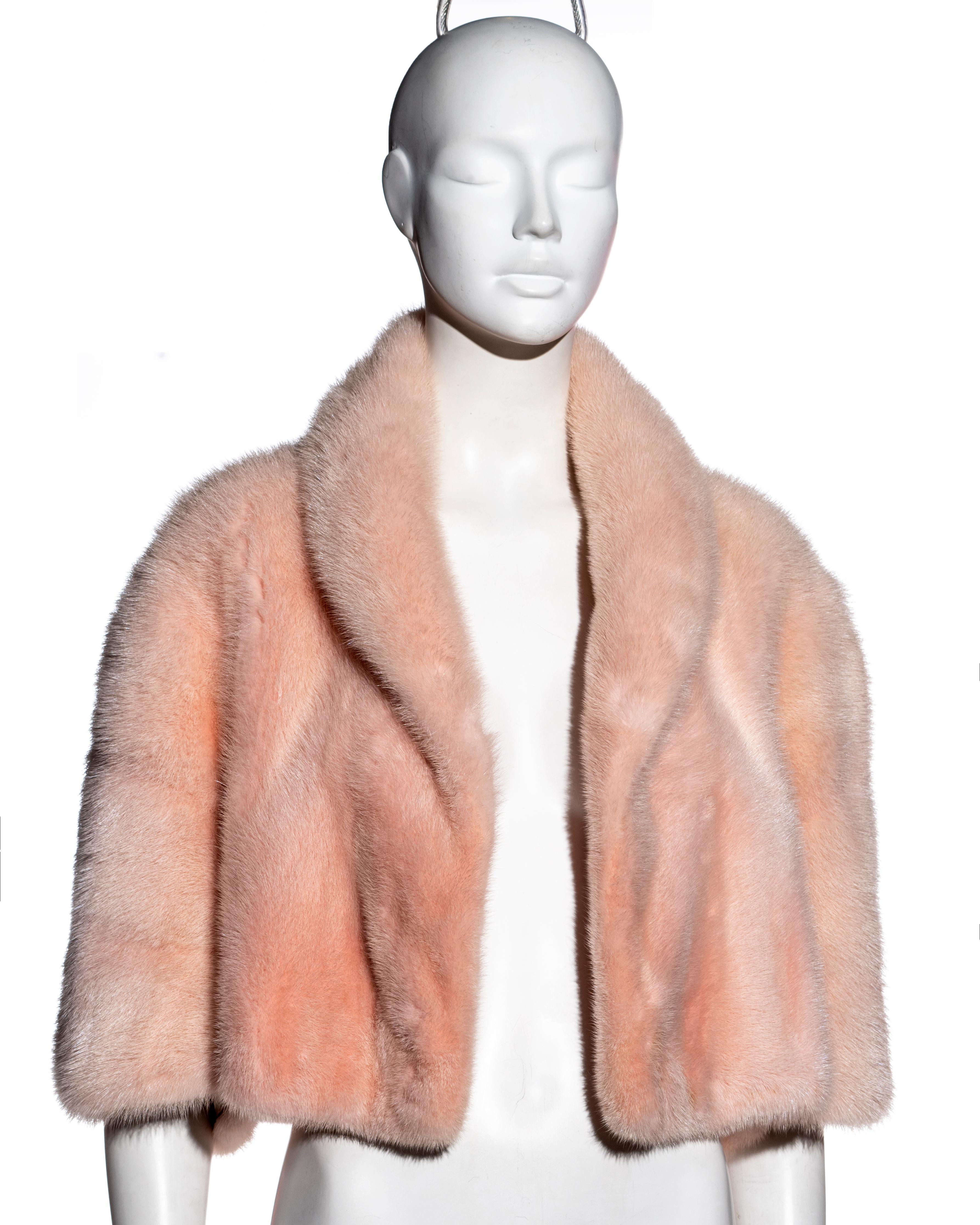 ▪ Christian Dior pink mink fur cropped bolero jacket
▪ Designed by John Galliano 
▪ Shawl lapel 
▪ Wide cropped sleeves appearing as a cape from the back 
▪ Silk lining with embroidered 'CD' 
▪ Open front 
▪ Size Medium
▪ Fall-Winter 1997
▪ 100%