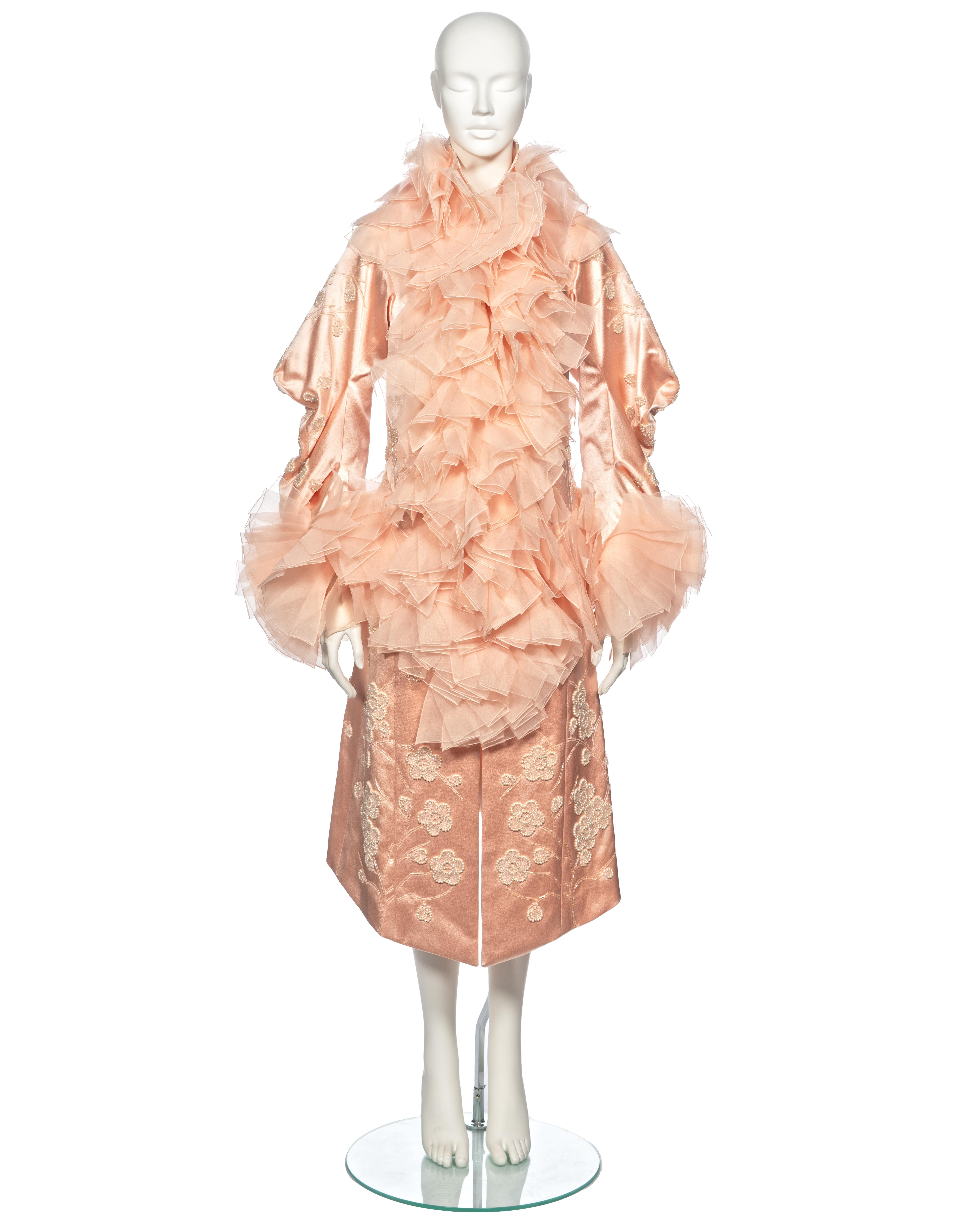 ▪ Archival Christian Dior Evening Coat
▪ Creative Director: John Galliano
▪ Hardcore Collection, Fall-Winter 2003
▪ Sold by One of a Kind Archive
▪ Museum Grade
▪ Crafted from exquisite blush pink silk
▪ Delicately embroidered florals embellished