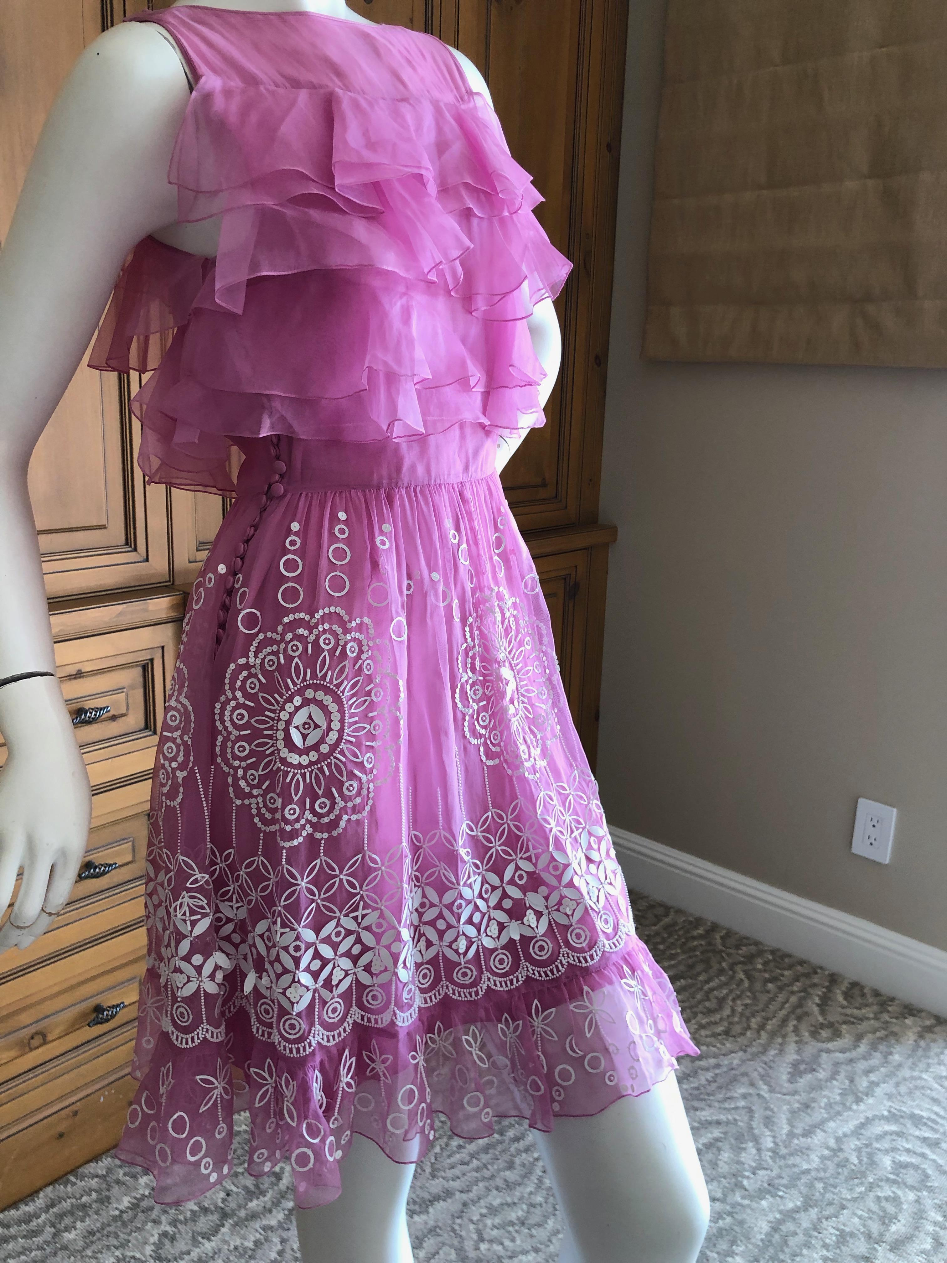 Christian Dior by John Galliano Pink Silk Dress with White Embellishments.
This is so pretty, please use the zoom to see the details.
The ornamentation is amazing, each sequin hand sewn in a folkloric pattern.
 Size 38
Bust 36