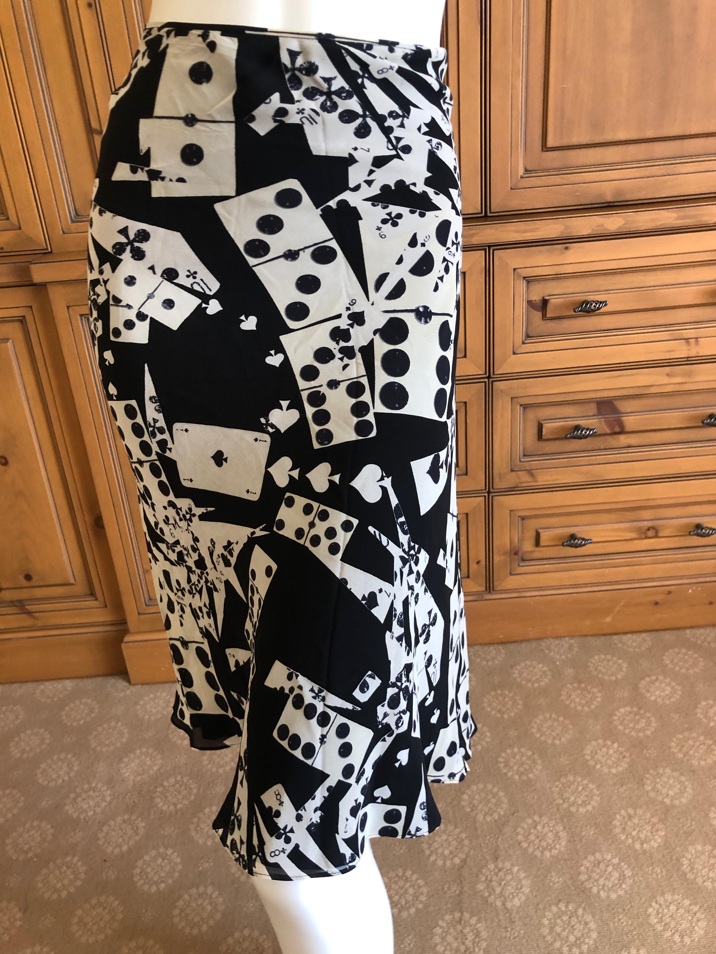 SquareTrade © AP6.0
Christian Dior John Galliano Playing Card and Domino Wrap Sweater and Matching Skirt. 
Sweater is silk cashmere wool blend, size 42, but as a wrap style it will fit many sizes.
Skirt is marked size 44
 Bust 36