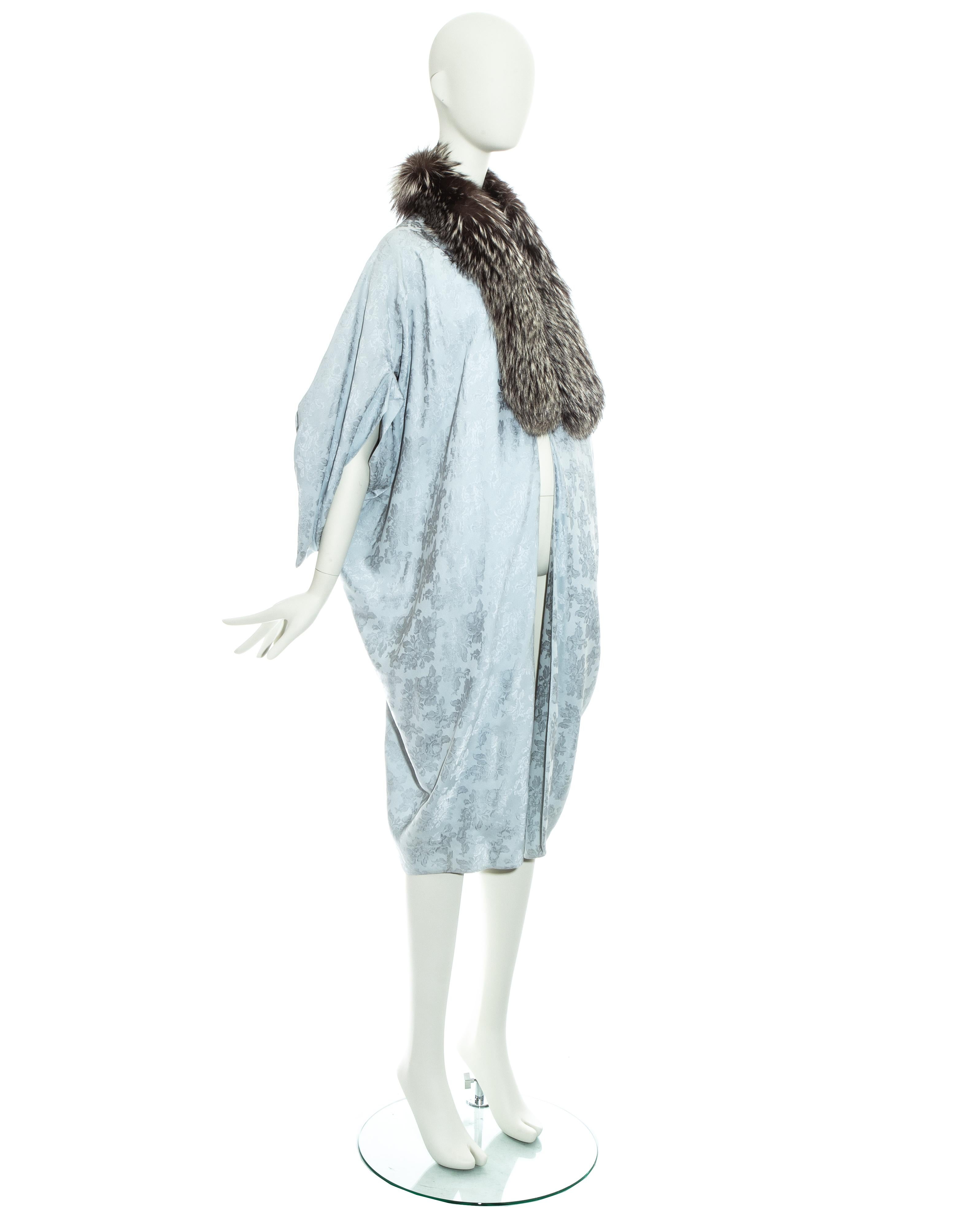 Christian Dior by John Galliano, powder blue silk brocade opera coat with grey fox fur collar 

Fall-Winter 1998