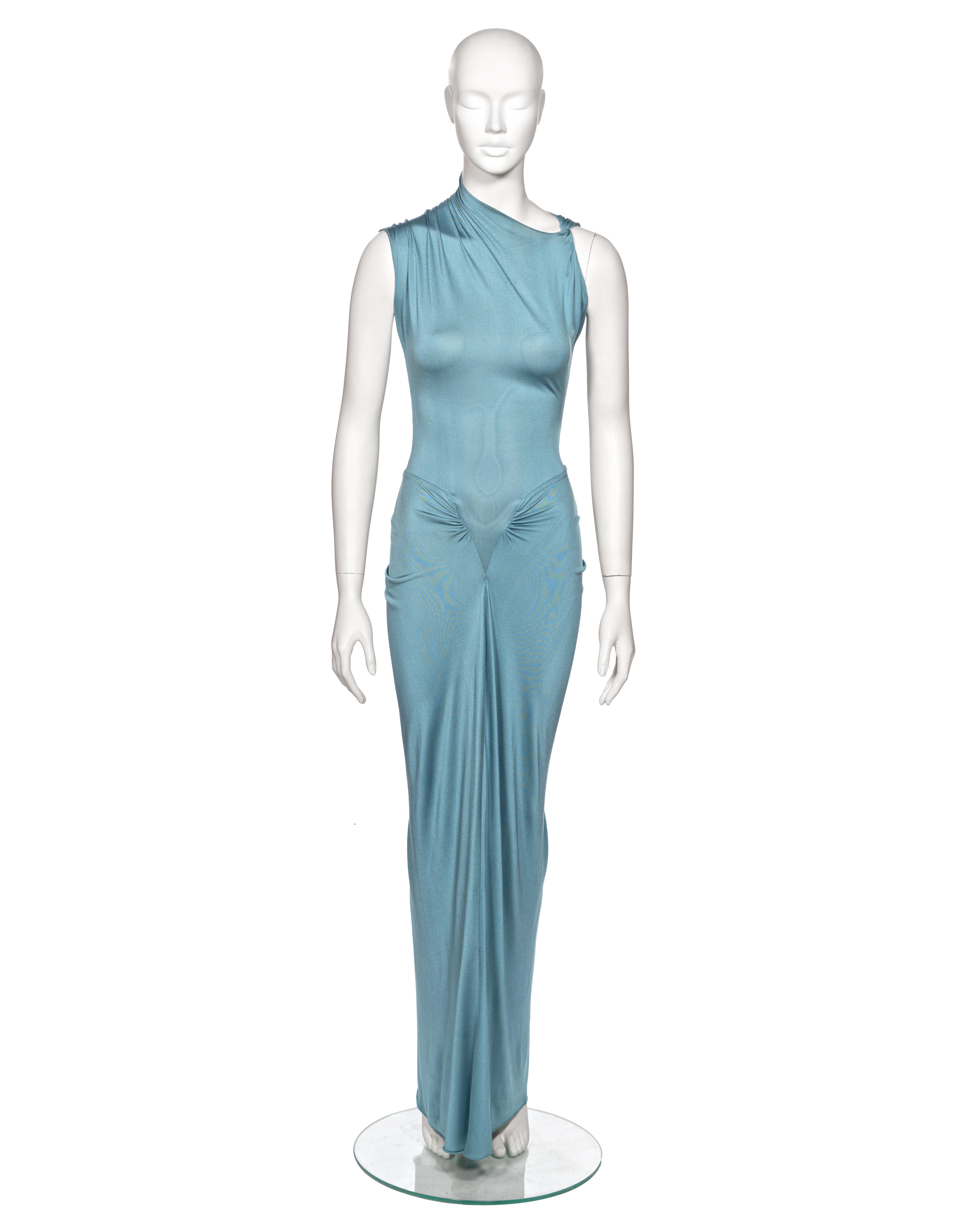 ▪ Rare Christian Dior Evening Dress
▪ Creative Director: John Galliano
▪ Spring-Summer 2000
▪ Crafted from powder blue silk jersey, this garment epitomizes elegance and modernity
▪ Features an asymmetric neckline with a gathered shoulder seam and