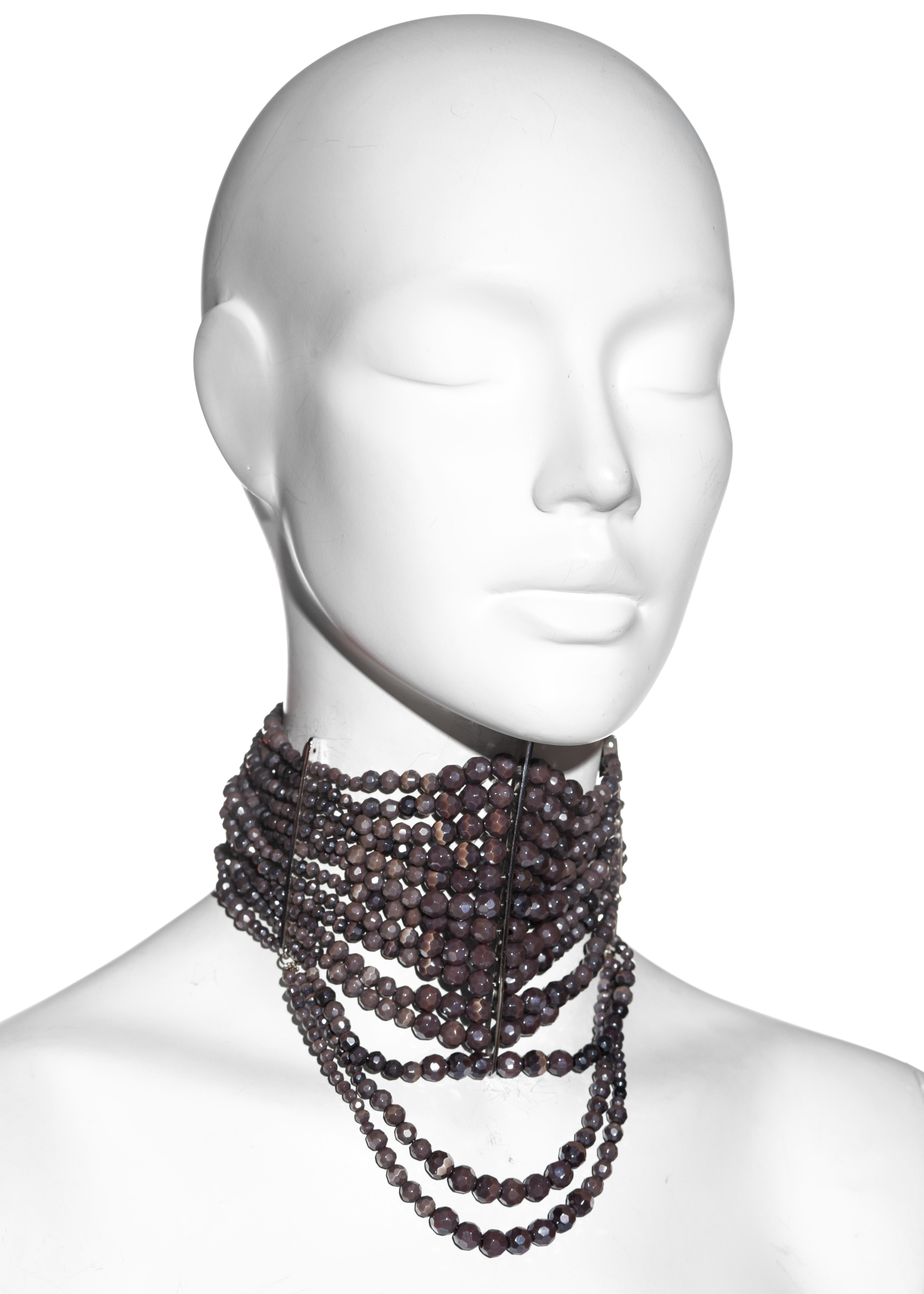 ▪ Christian Dior masai choker necklace
▪ Designed by John Galliano 
▪ 12-strands of purple-coloured faceted beads with 2 fixed looped strands 
▪ Silver metal hardware
▪ 2 chain closures at back for additional width 
▪ Spring-Summer 1998
