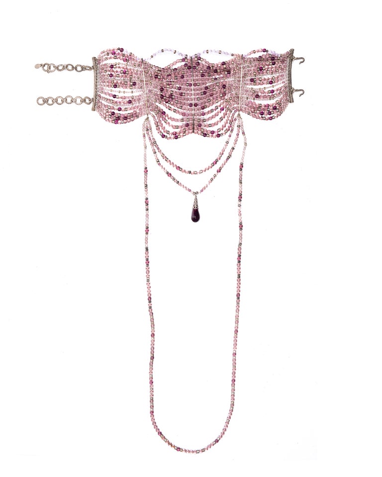 ▪ Christian Dior purple glass bead choker necklace 
▪ Designed by John Galliano 
▪ 18-strands of purple glass beads with 3 looped strands 
▪ Large glass stone hangs at the centre 
▪ Antique-style silver hardware 
▪ 2 chains closures at the back 
▪