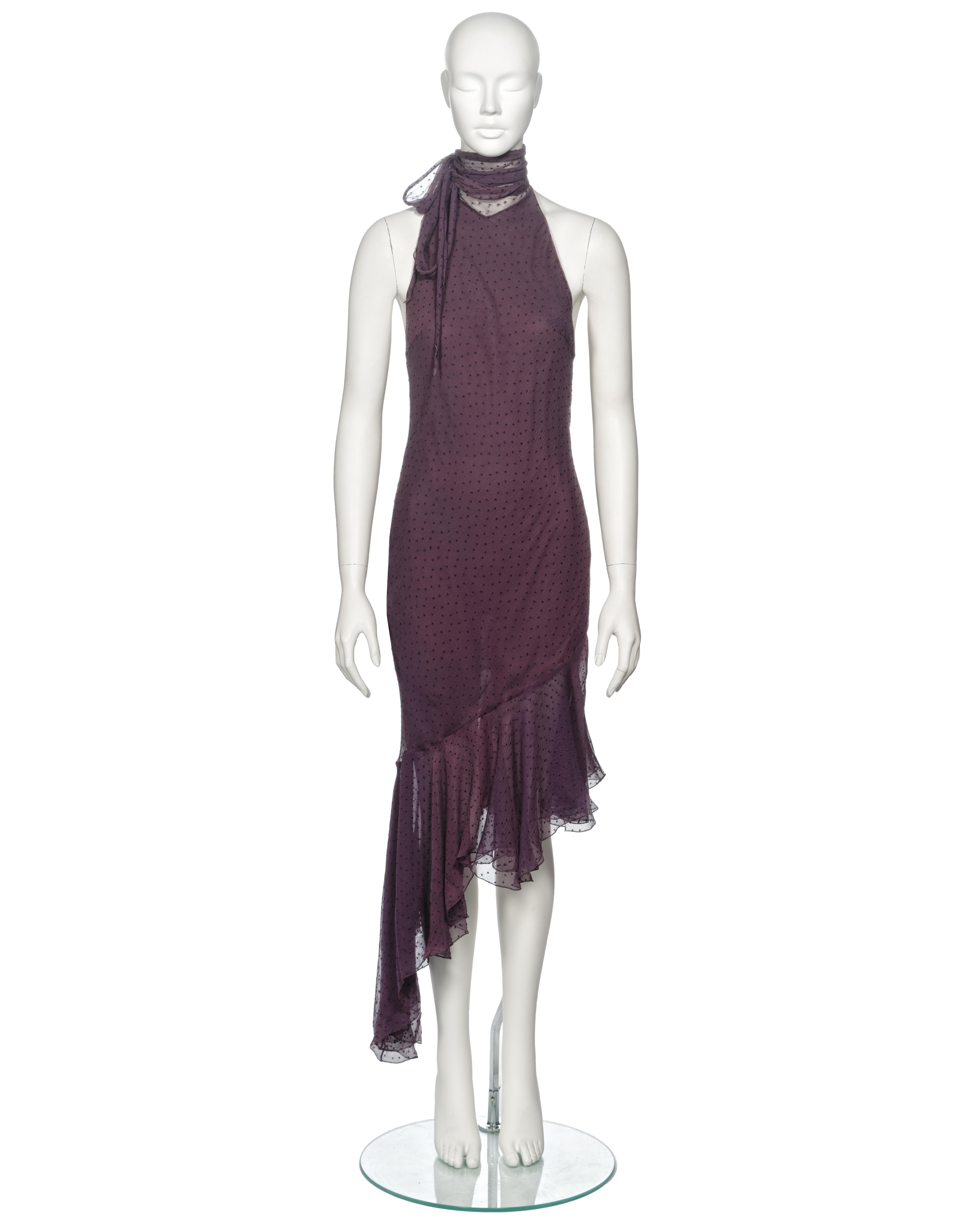 ▪ Archival Christian Dior Cocktail Dress
▪ Creative Director: John Galliano
▪ Fall-Winter 2000
▪ Sold by One of a Kind Archive
▪ Purple silk chiffon with a jacquard polkadot pattern in viscose yarn 
▪ Halter neck with scarf ties
▪ Asymmetric