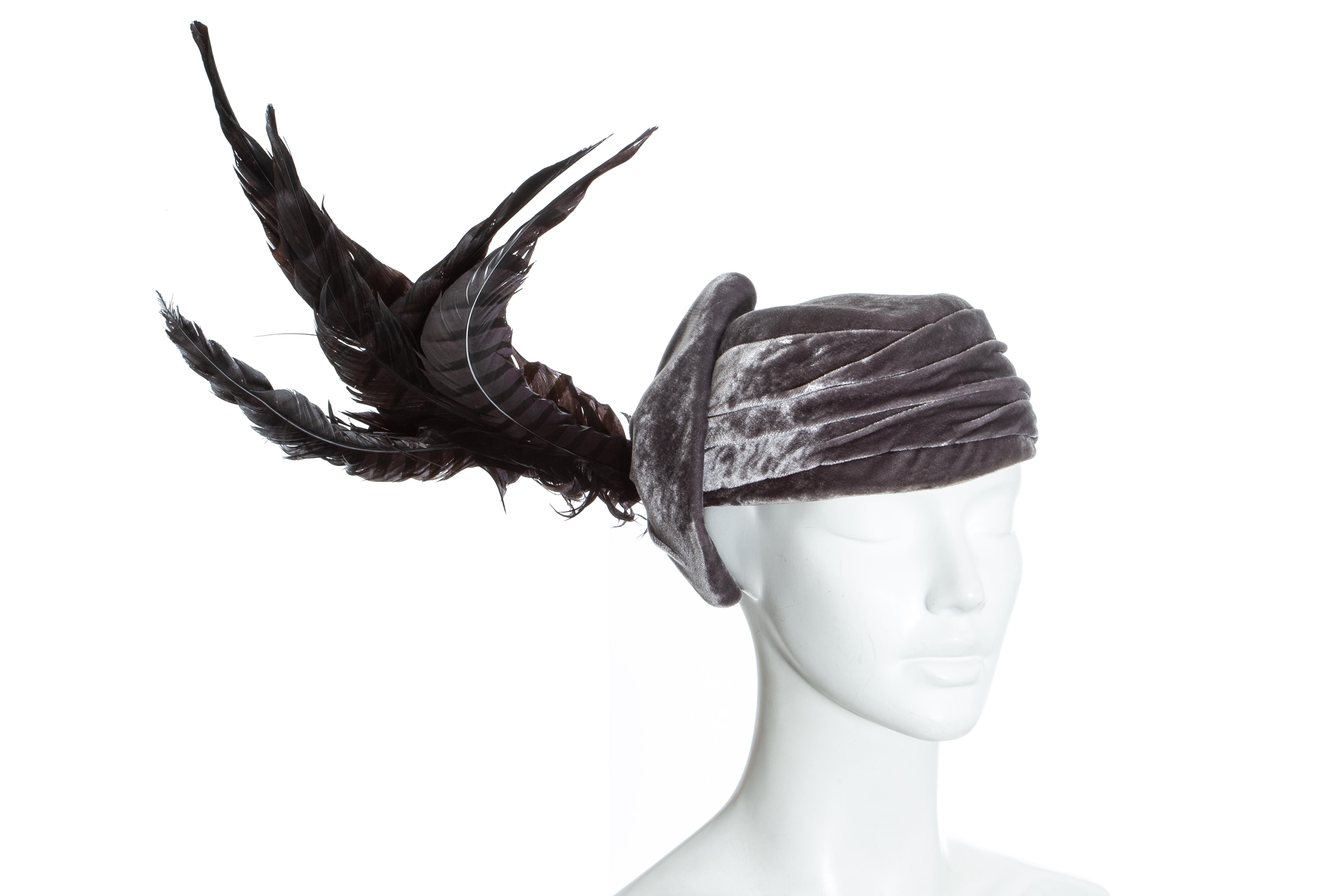 Christian Dior by John Galliano purple velvet pill box hat with large sweeping feathers. Probably designed by Steven Jones

c. 2000 - 2010