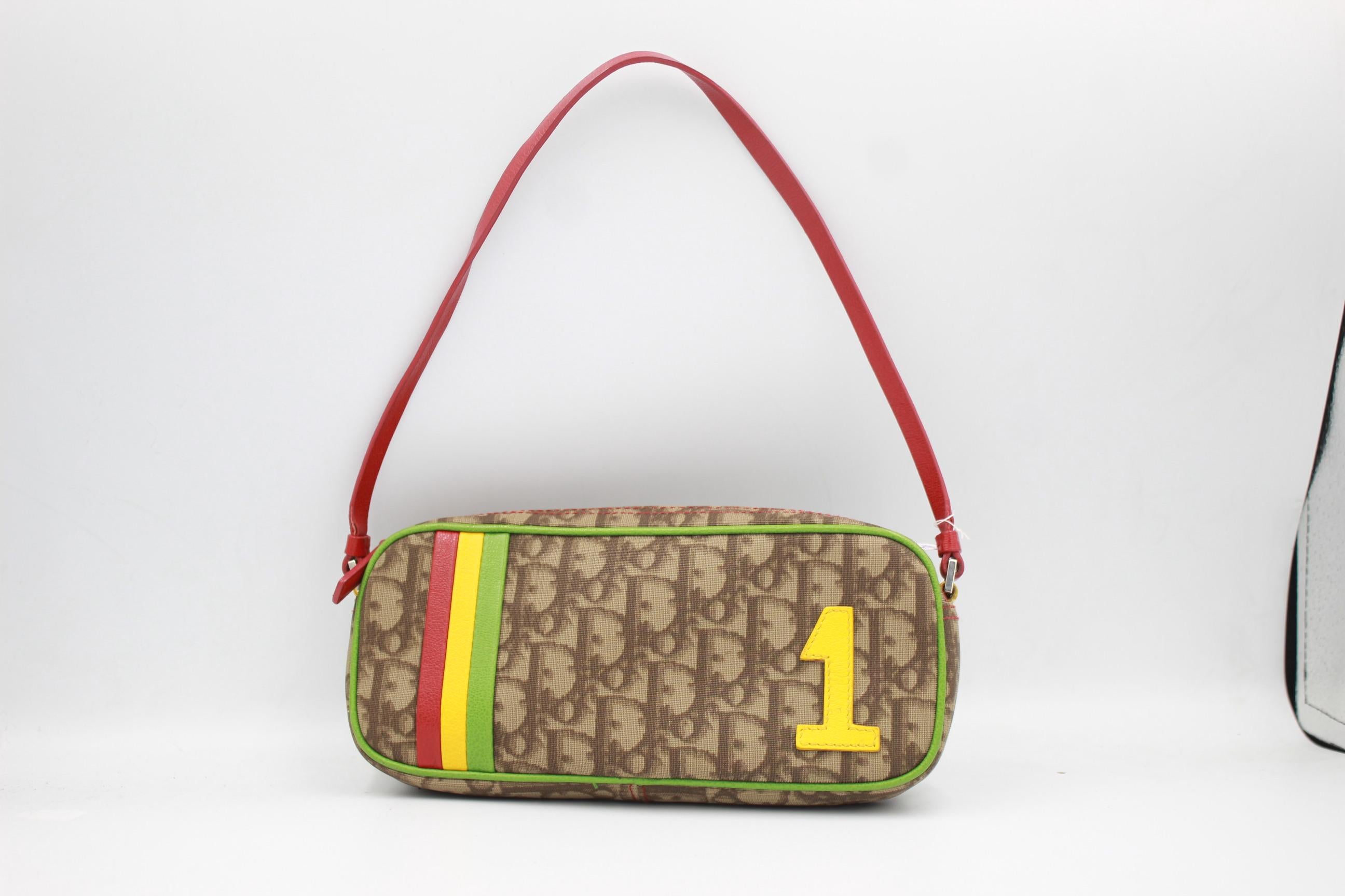 Christian Dior Rasta bag in canvas and multicolor leather. 
Good condition.
Dimensions: 20cm x 10cm