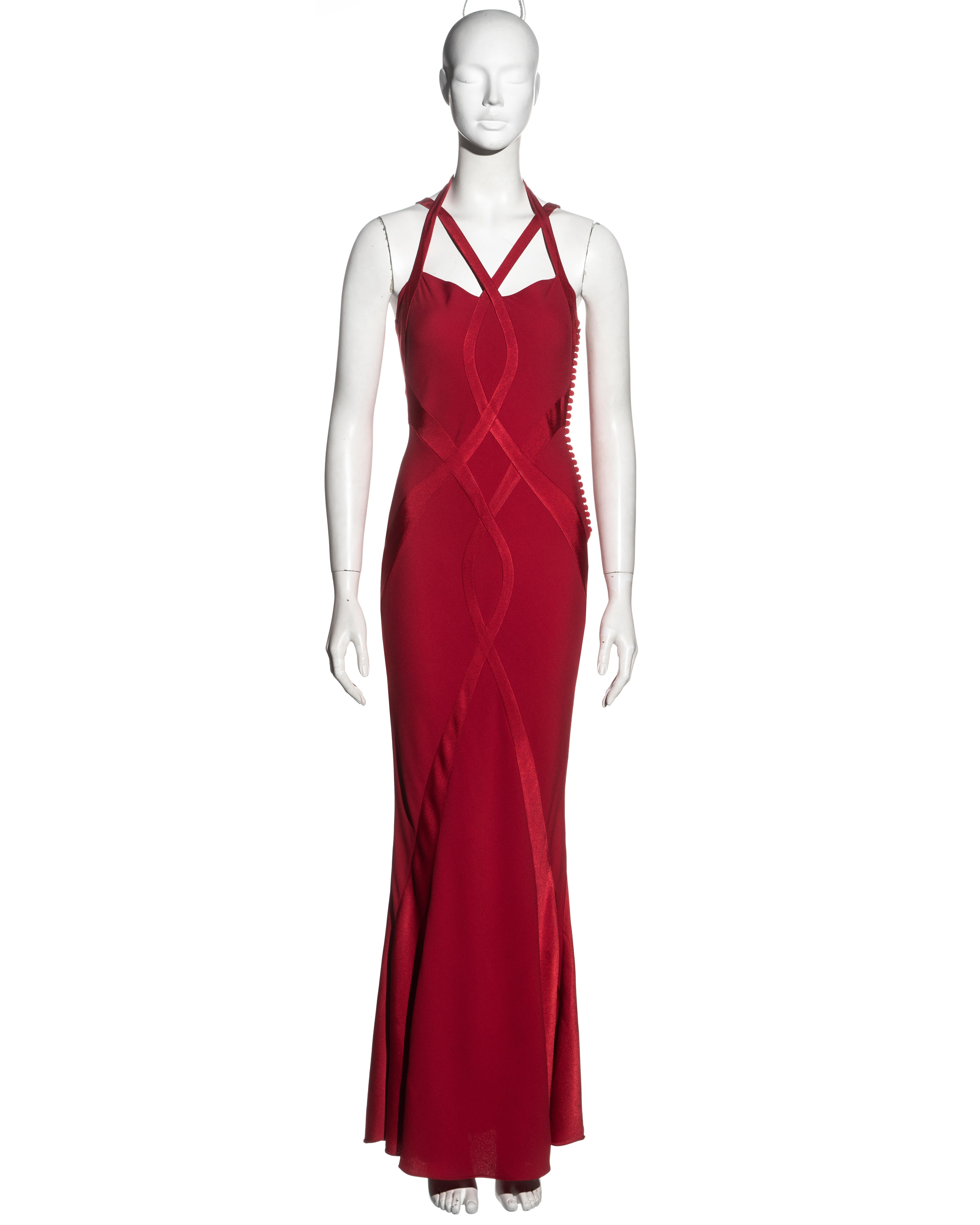 ▪ Christian Dior red evening dress 
▪ Designed by John Galliano
▪ Red satin-backed crepe 
▪ Multiple curved panels 
▪ Halter neck and shoulder straps 
▪ Floor-length skirt 
▪ FR 36 - UK 8 - US 4
▪ Fall-Winter 2004
▪ 68% Acetate, 32% Viscose 
▪ Made