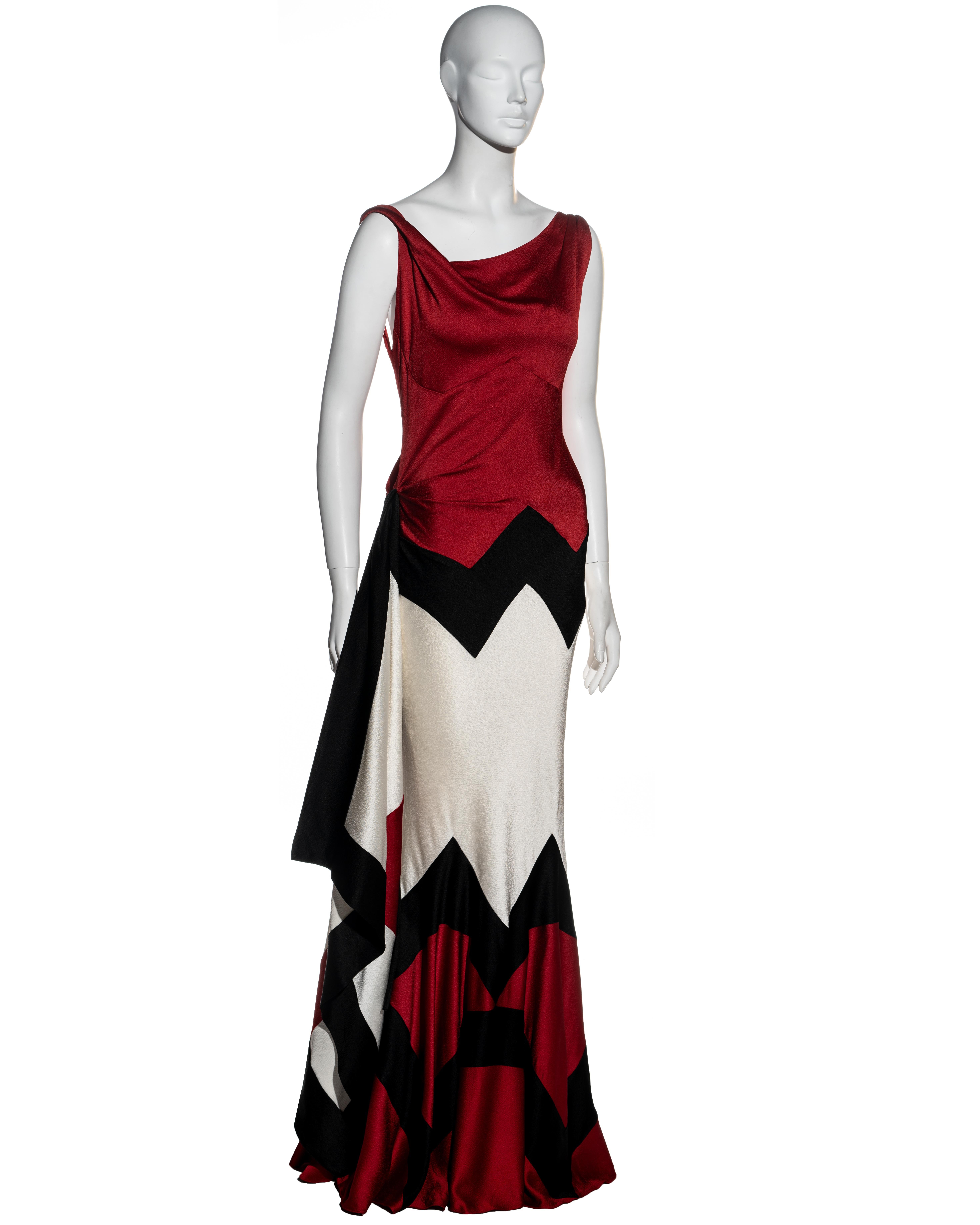 ▪ Christian Dior red, black and white evening dress 
▪ Designed by John Galliano
▪ Asymmetric cowl neckline
▪ Twisted shoulder strap 
▪ Asymmetric drapery on bodice 
▪ Low back 
▪ Hanging draped panel knotted at the hip 
▪ Colour palette inspired by