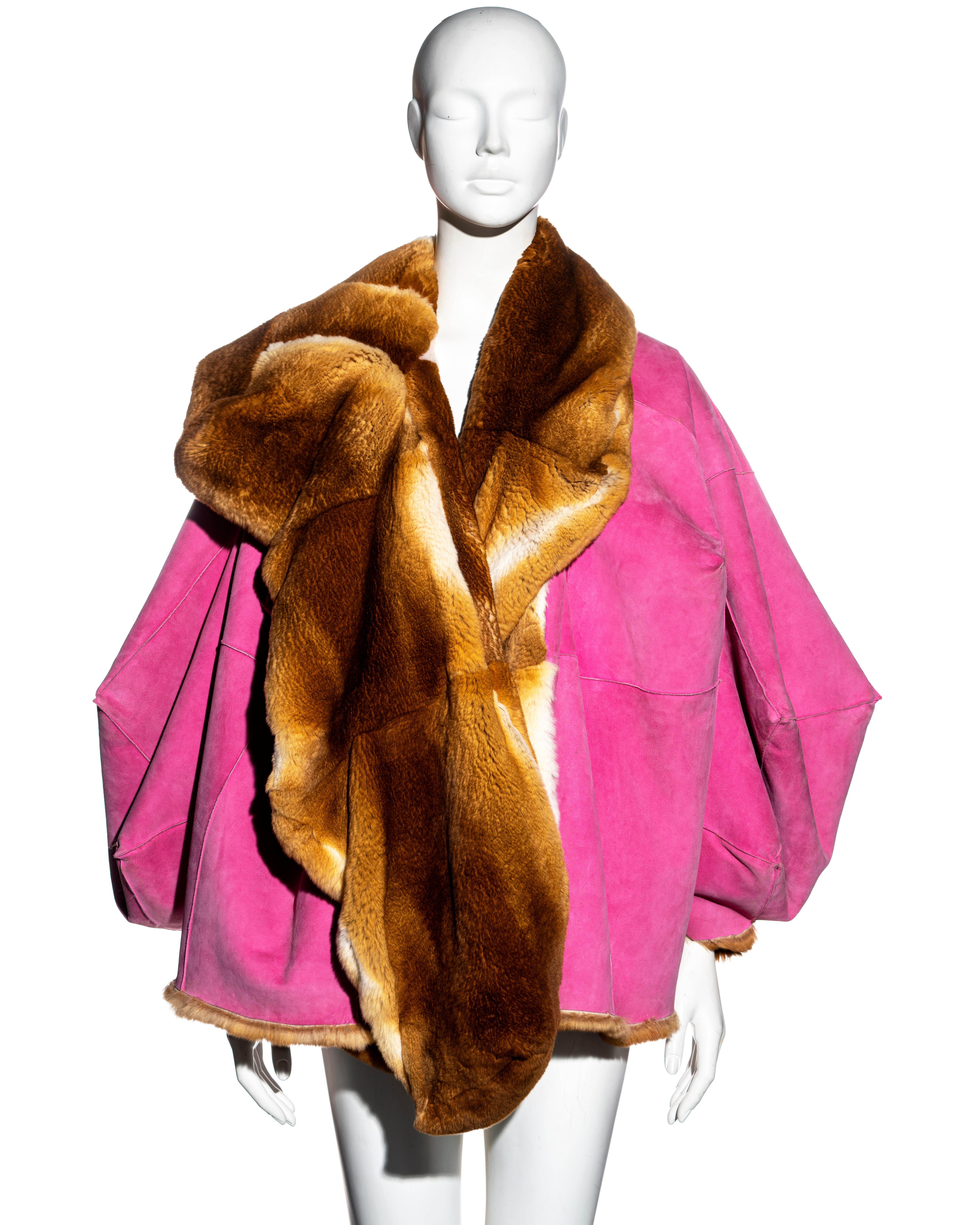 ▪ Christian Dior reversible pink and golden brown fur jacket 
▪ Designed by John Galliano 
▪ Oversized fit 
▪ Cube shaped sleeves
▪ Vibrant pink suede 
▪ Golden brown fur (origin unknown feels like Chinchilla) 
▪ Large collar 
▪ Two side pockets
▪