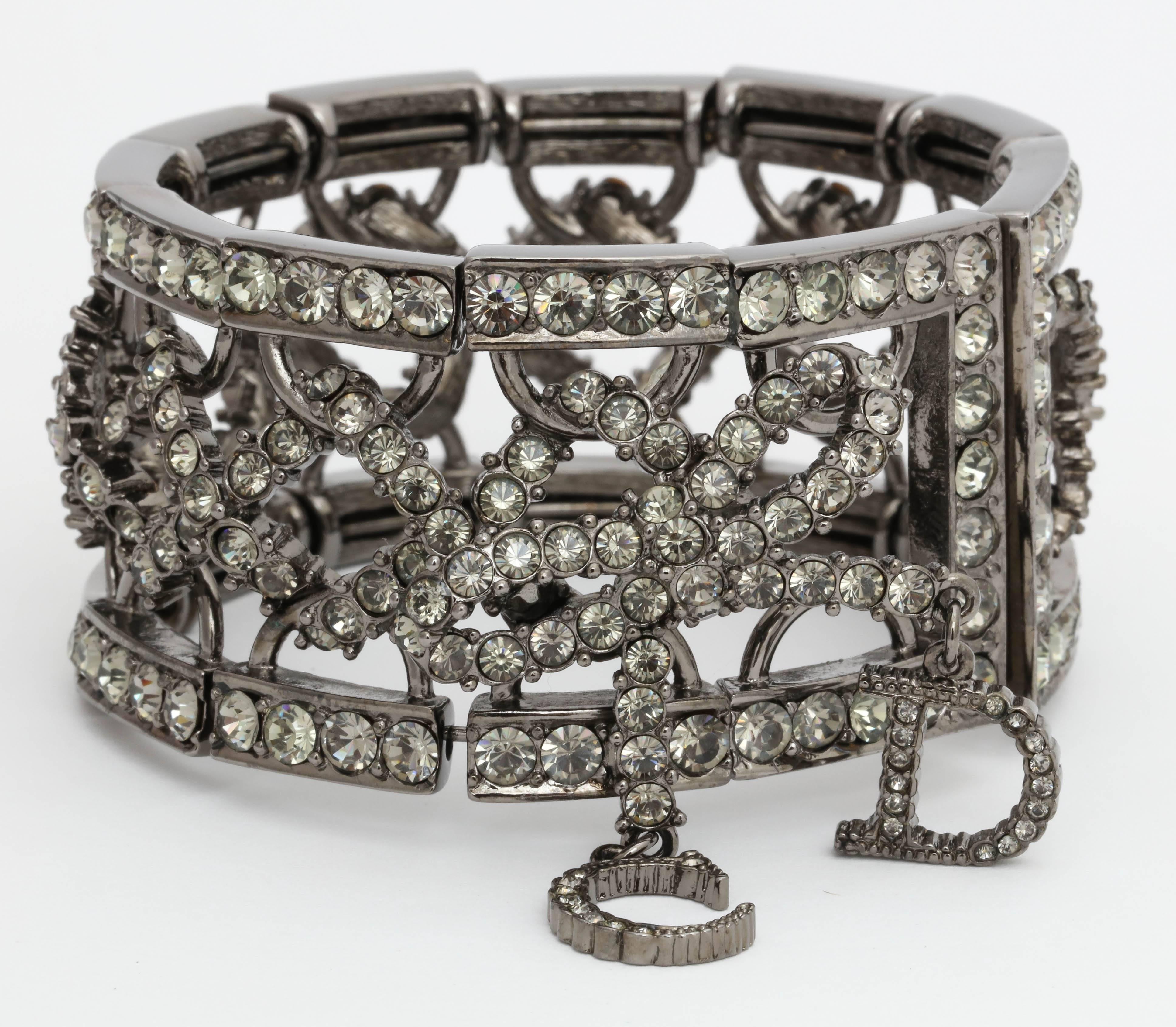 Beautiful Christian Dior by John Galliano bangle with bow and rhinestones.
Adjustable, one size fits all.