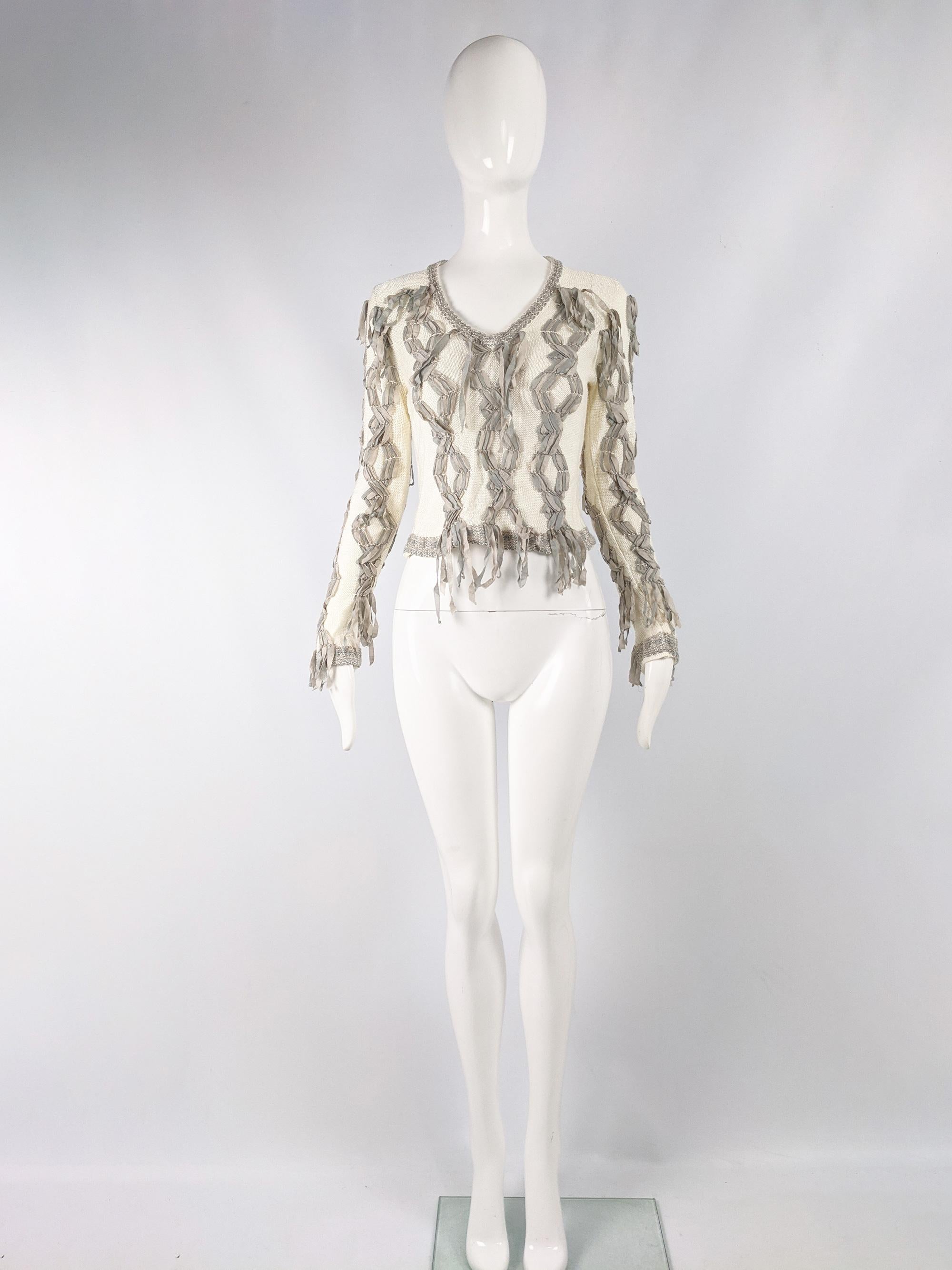 A beautiful womens Christian Dior Boutique sweater from the early 2000s, designed by John Galliano. In a cream knit fabric with beautiful, intricate ribbonwork. 

Size: Marked vintage F 40 but fits more like a modern UK 10/ US 6/ EU 38. Please check
