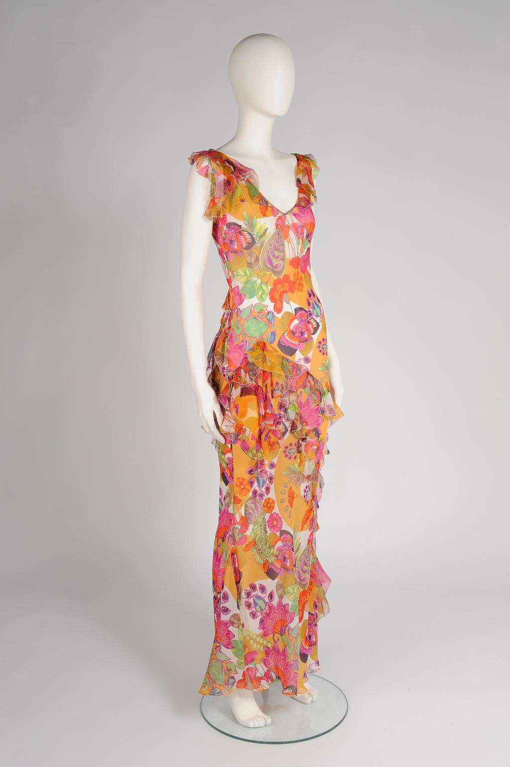 Julia's Dressing Vintage is proud to offer this stunning vintage John Galliano for Christian Dior evening gown. Cut on the bias from light and airy floral-print silk chiffon to skim your figure, the dress is detailed with romantic ruffles. Elegant