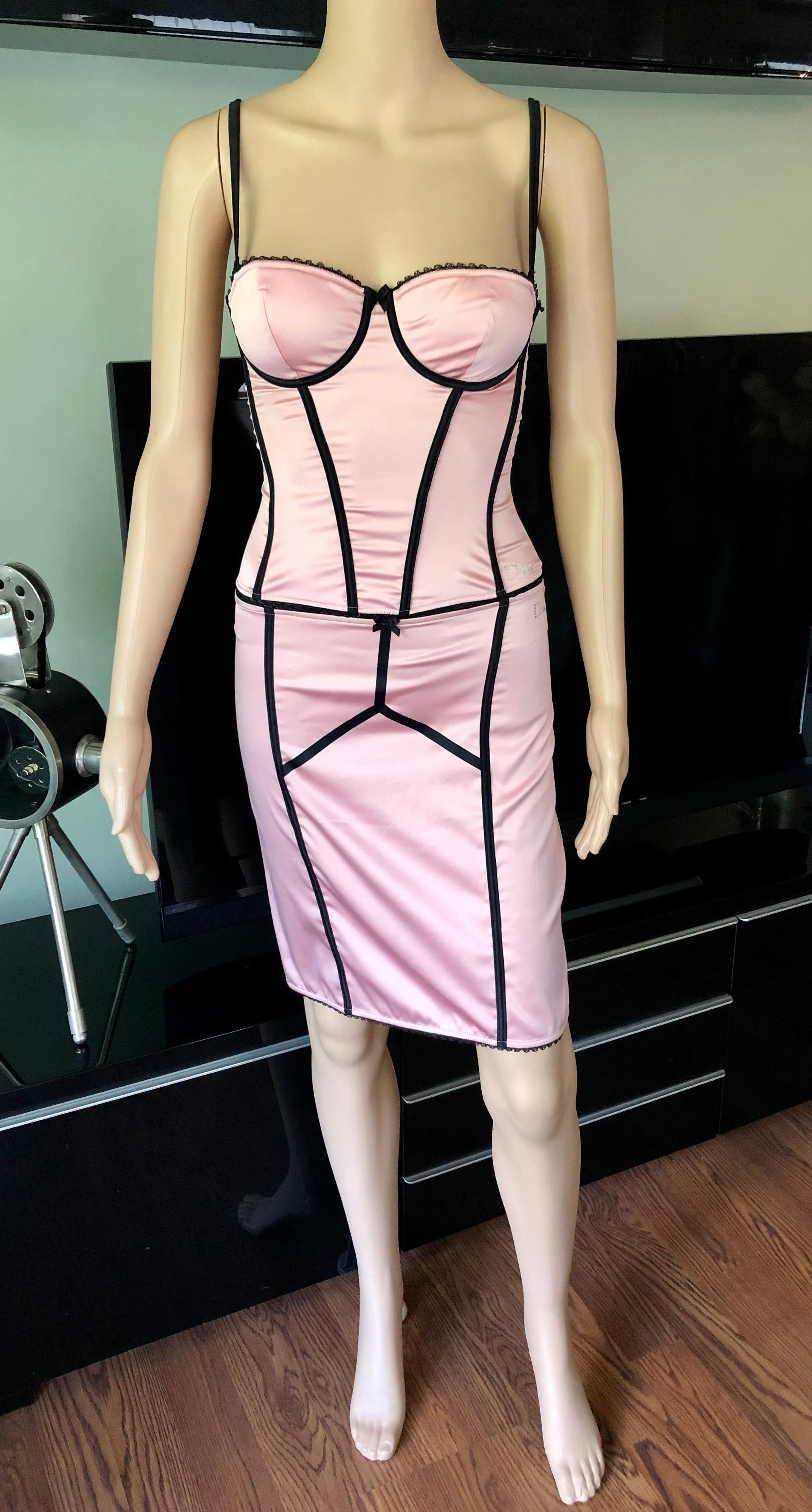 Christian Dior By John Galliano S/S 2002 Unworn Bustier Silk Pink Corset Top & Skirt 2 Piece Set FR 36

Christian Dior by John Galliano silk bustier top featuring crystal embellished logo, detachable straps, padded bust, and hook-and-eye closure.