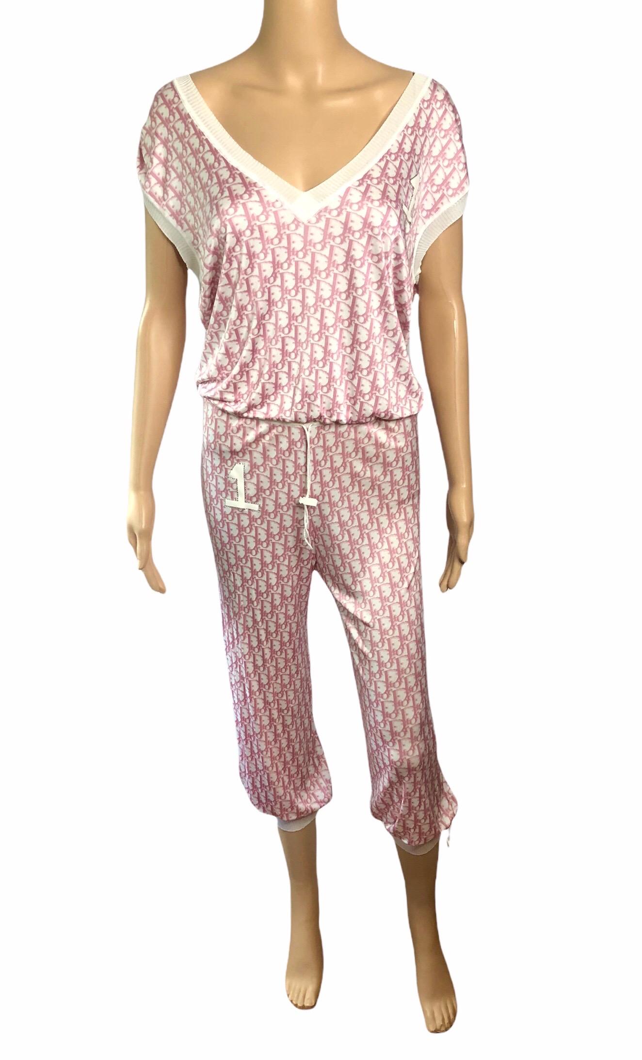 Christian Dior By John Galliano S/S 2004 Pink Diorissimo Monogram Logo Pants & Top 2 Piece Set FR38/FR42

Christian Dior by John Galliano 2 Piece Set featuring the iconic Diorissimo print and Swarovski embellished number 1 on the chest and pants.