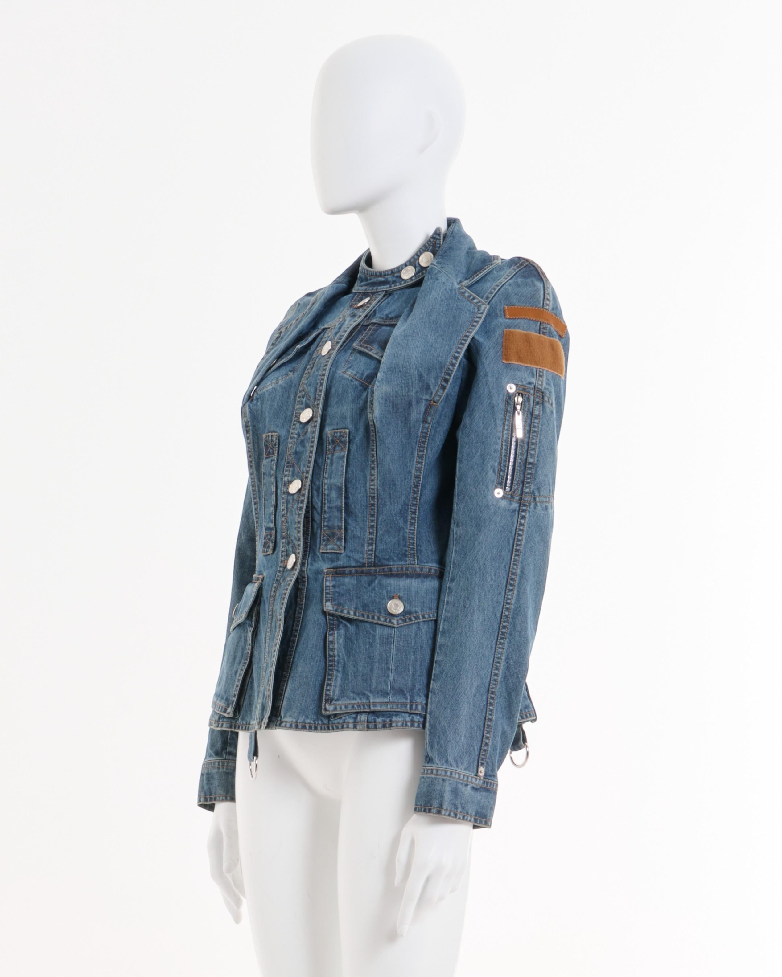 - Designed by John Galliano
- Spring Summer 2005
- Double Layered Denim Blue Jacket
- Button Up closure
- High buttoned neckline
- Multiple pockets
- Brown patch on the shoulder
- Zipped pockets on the shoulder
- Excellent Condition
- Made in