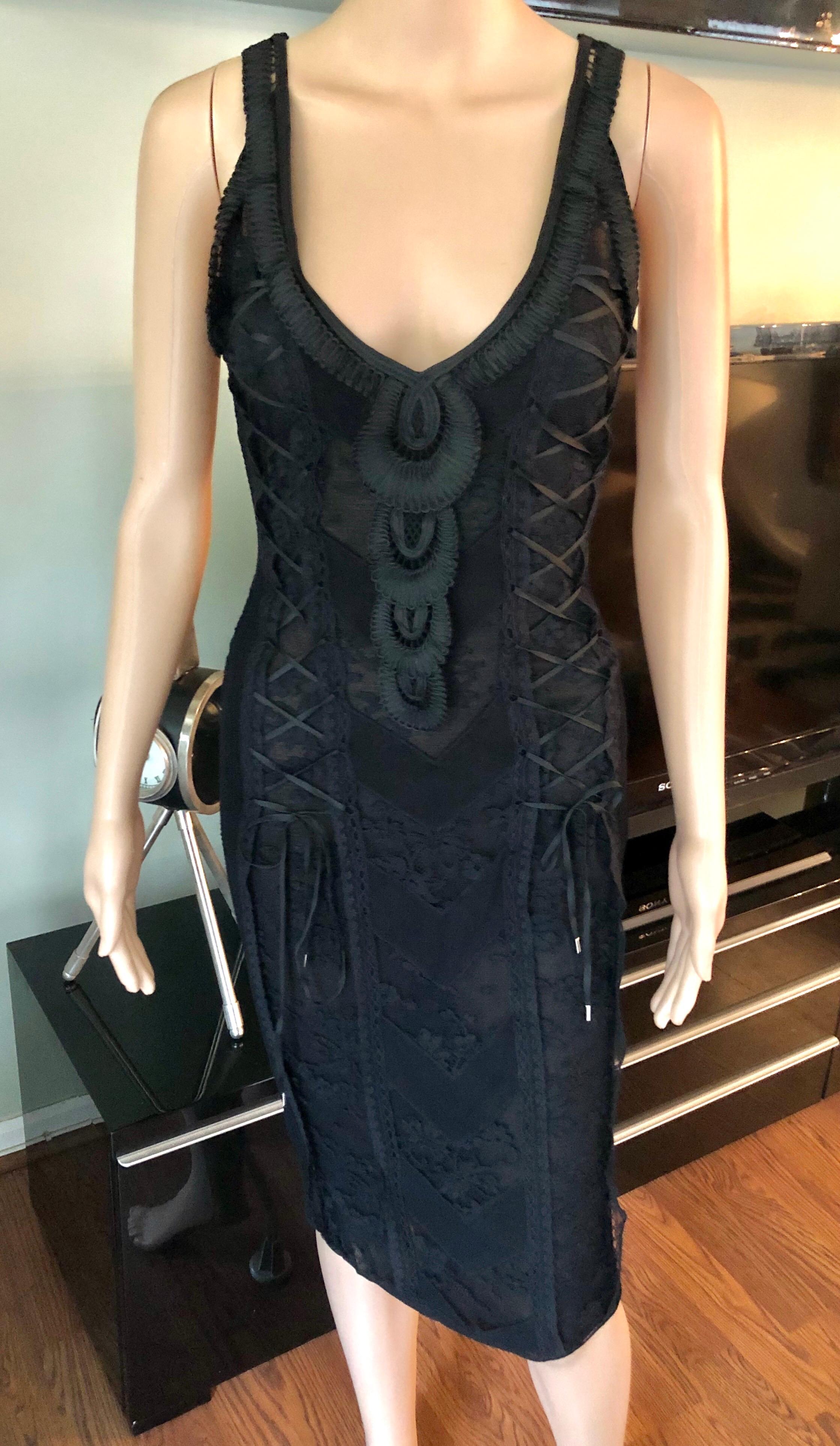 Christian Dior by John Galliano S/S 2006 Sheer Lace Trimmed Corset Knit Black Dress FR 36

Christian Dior midi dress featuring lace and embroidered trim throughout, V-neck and corset tie accents at front.
