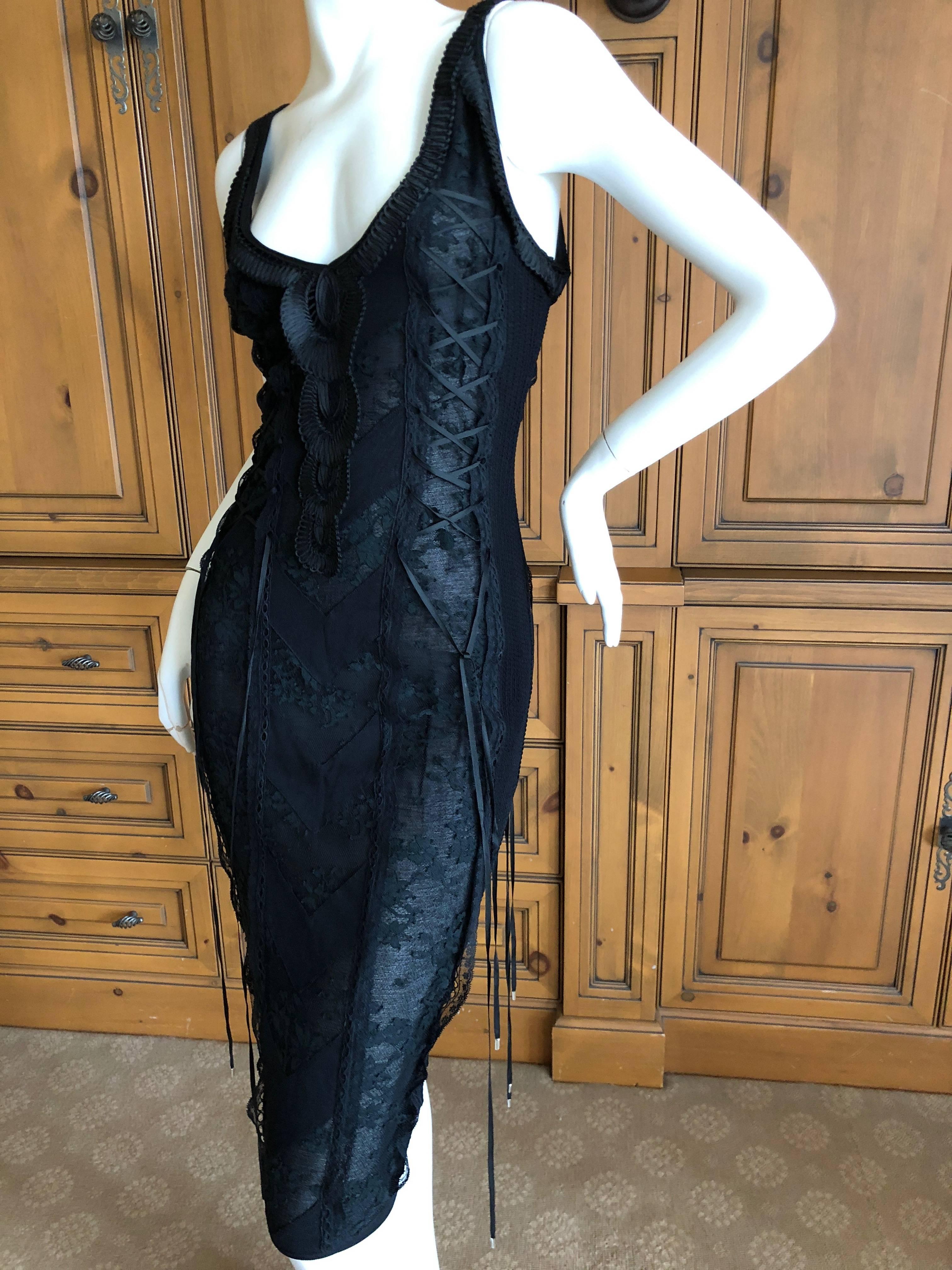 
Christian Dior John Galliano sheer lace chevron dress with corset lacing up the sides and back.
Trimmed with soutache.
There is an underlining so it isn't totally sheer, would be fun to remove the lining.
 Size 38 
Bust 36