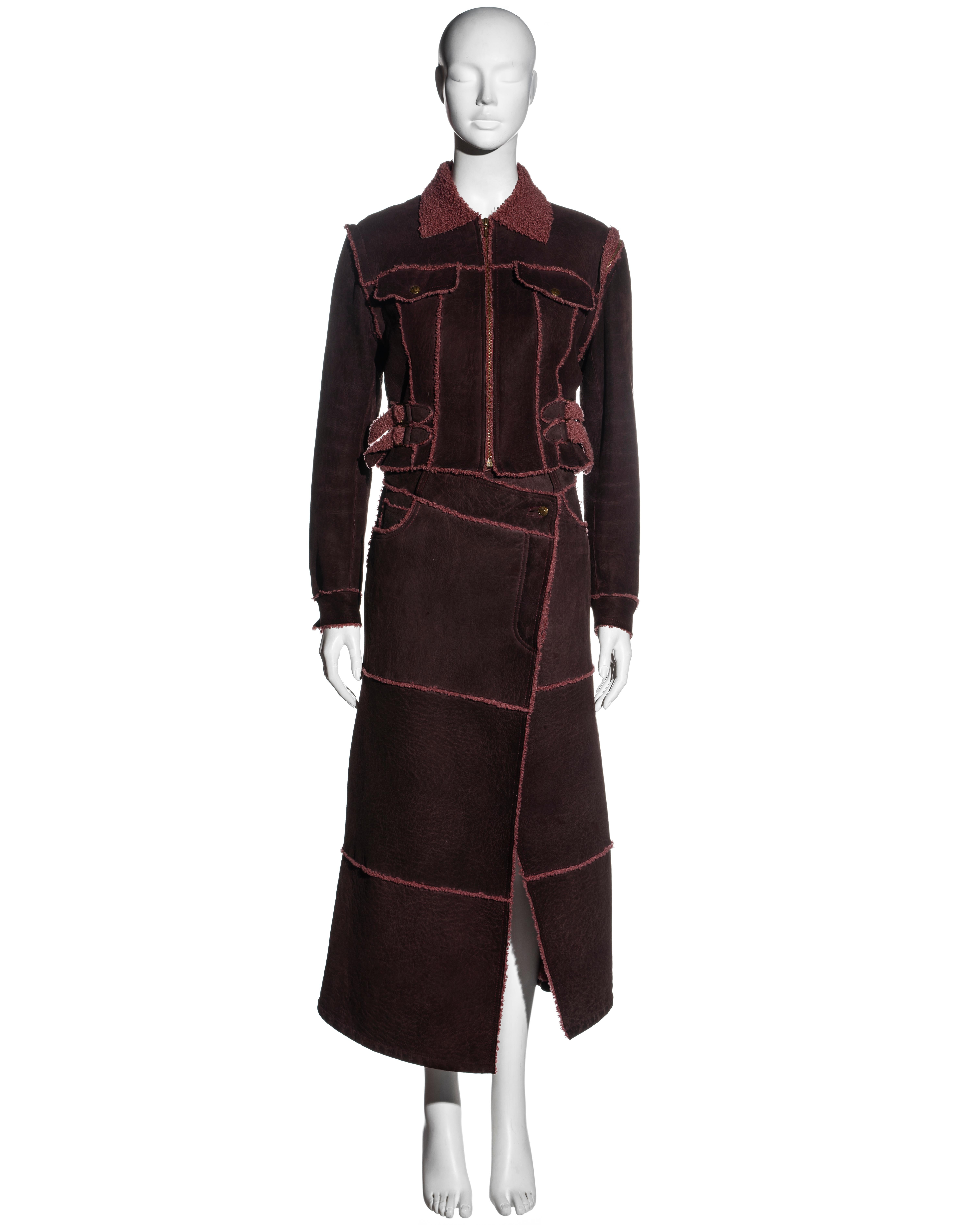 ▪ Christian Dior burgundy shearling 2-piece set 
▪ Designed by John Galliano 
▪ Fitted jacket 
▪ Maxi wrap skirt 
▪ Inverted seams 
▪ Detachable sleeves 
▪ Buckle ties at the waist 
▪ FR 38 - UK 10 - US 6
▪ 100% Shearling
▪ Fall-Winter 2000
