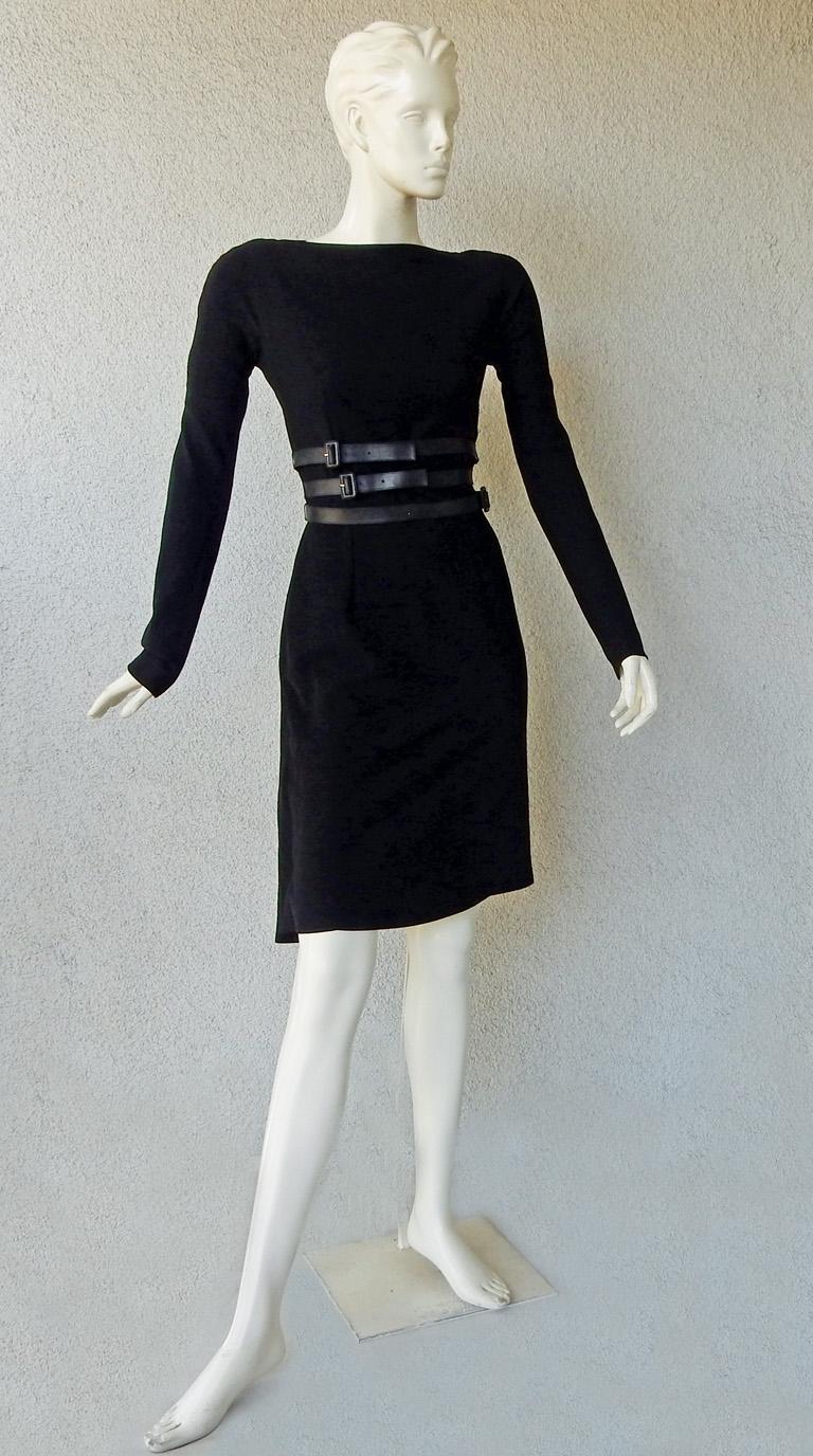 Christian Dior by John Galliano tailored black wool dress inspired by 1950's Christian Dior Haute Couture fashion.  Beautifully designed featuring fitted sheath style dress with draped bustle reflecting the draping and style of the New Look