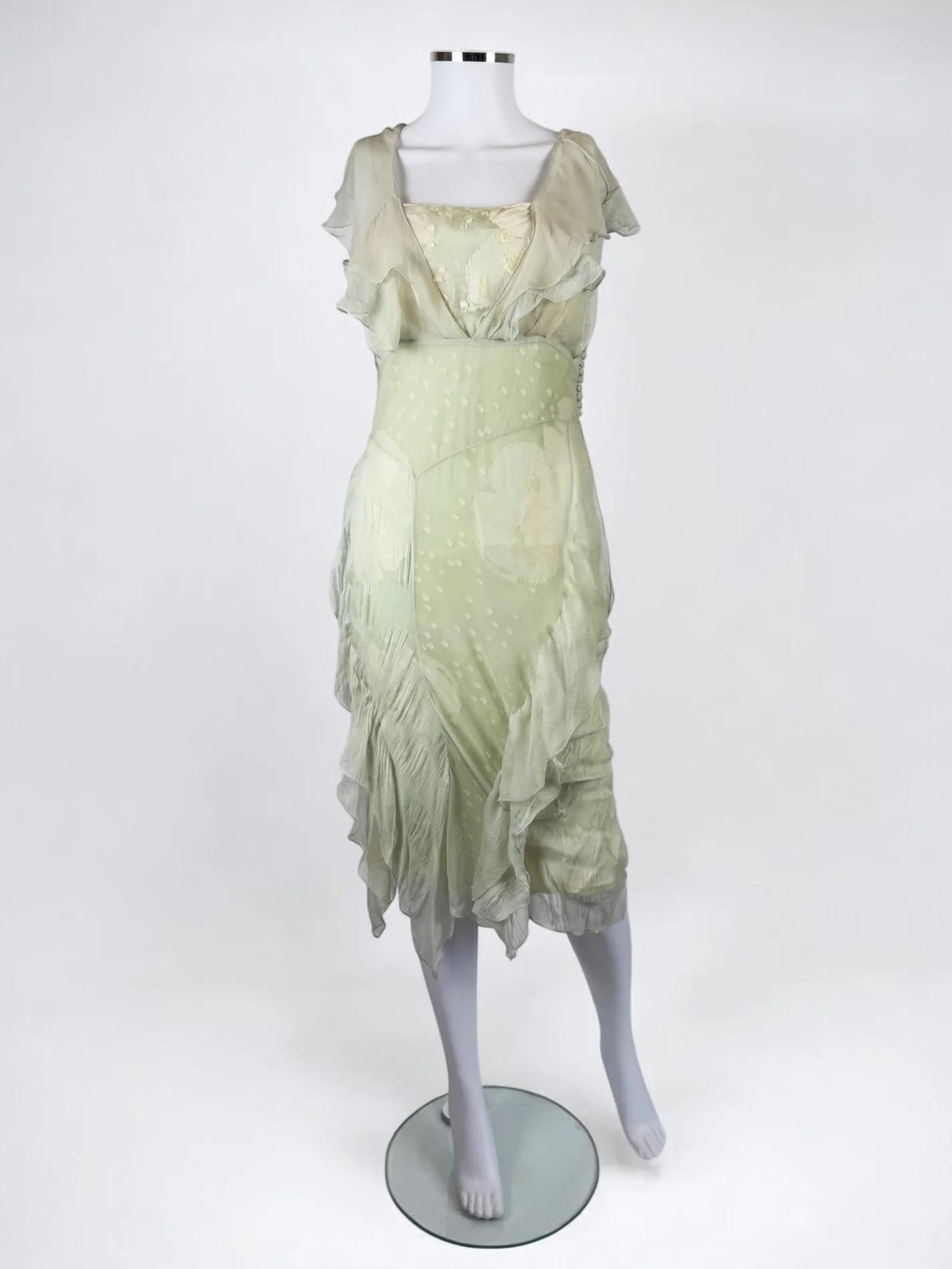 Christian Dior by John Galliano silk cocktail dress, 2006
Comprised of several silk layers.
Thin spaghetti style straps with silk floaty sleeves which can also be worn draped down off the shoulder
Asymmetric hemline
Fair to good vintage condition