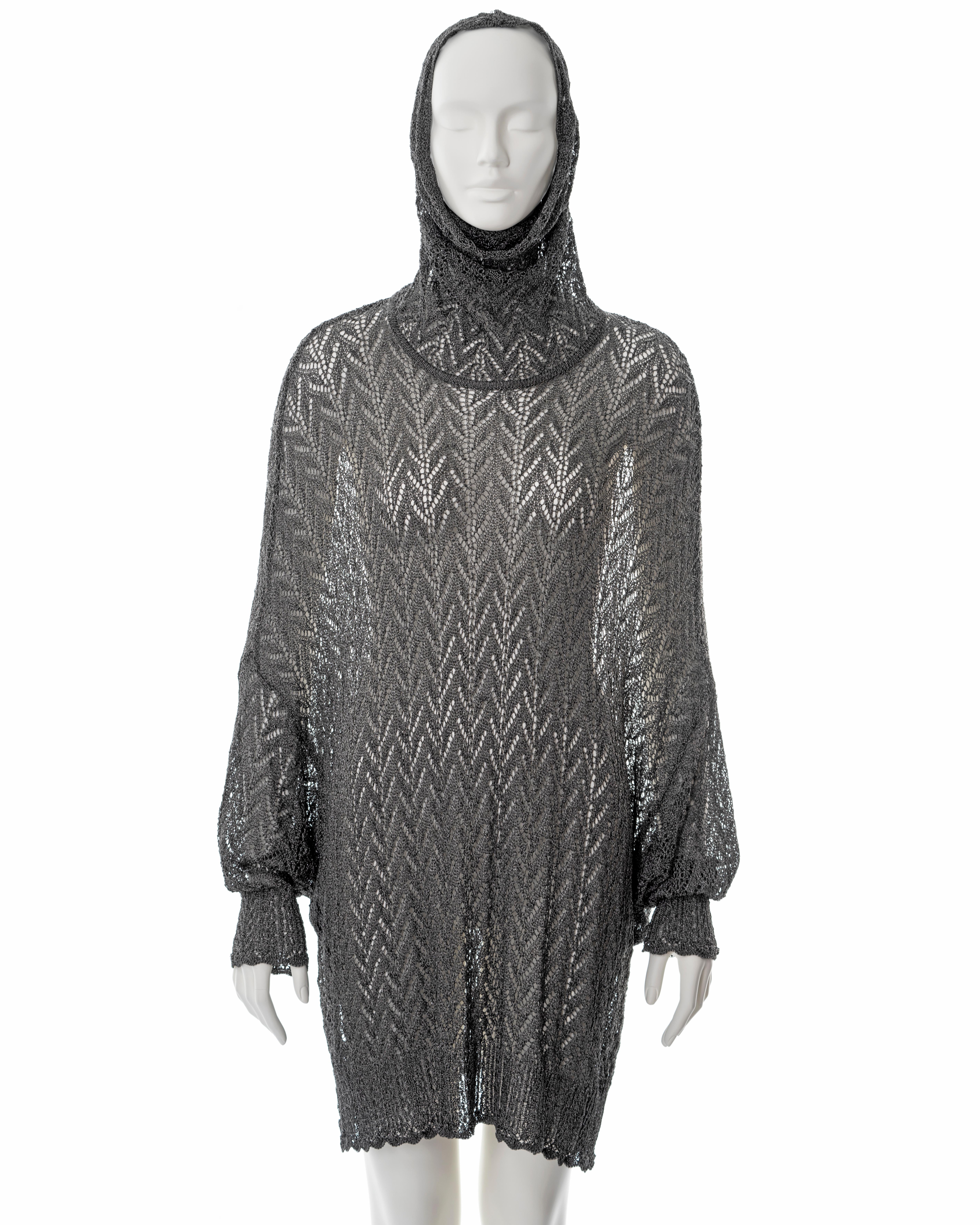 ▪ Christian Dior silver crochet sweater dress
▪ Designed by John Galliano
▪ Sold by One of a Kind Archive
▪ Fall-Winter 1998
▪ Long turtleneck doubles as a hood 
▪ Wide cut 
▪ Size Small
▪ Made in France

All photographs in this listing EXCLUDING