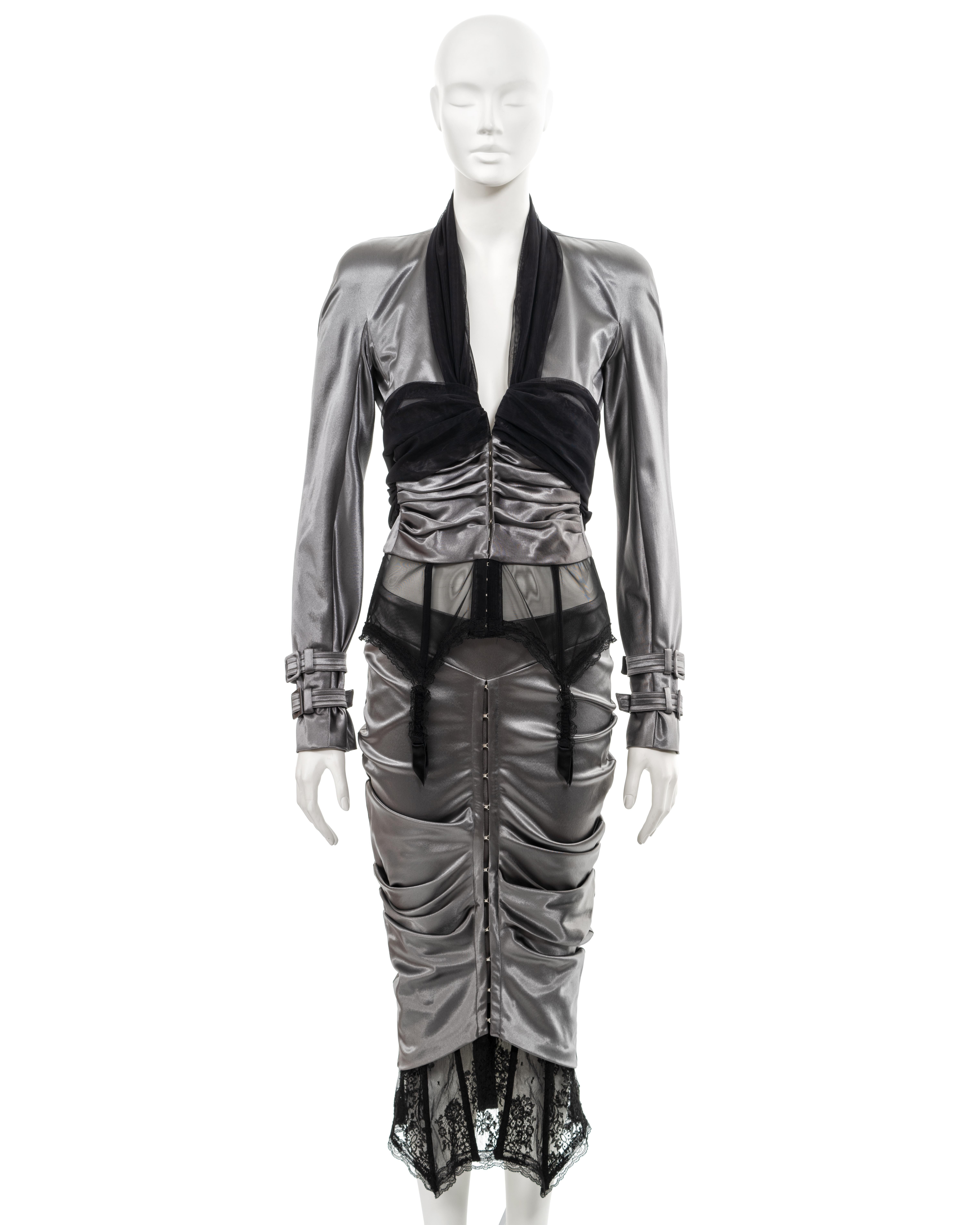 ▪ Christian Dior evening skirt suit 
▪ Creative Director: John Galliano
▪ Sold by One of a Kind Archive
▪ 'Homage to Marlene', Spring-Summer 2004
▪ Museum Grade
▪ Constructed from silver-grey stretch satin 
▪ Jacket and skirt with boned suspender