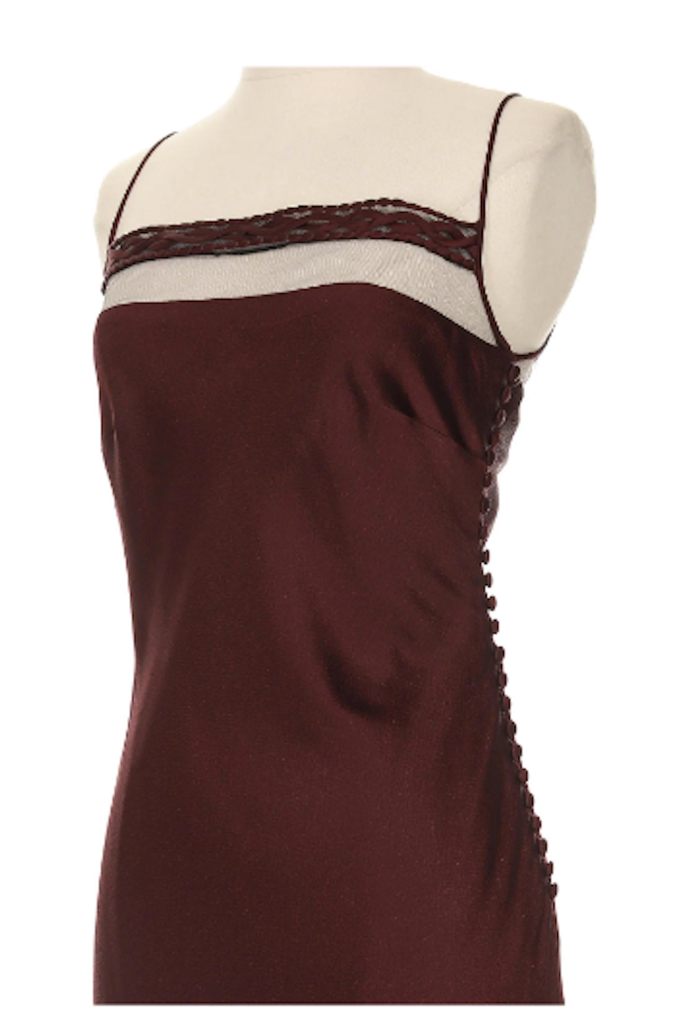 - Christian Dior by John Galliano Burgundy Silk Slip Dress. Likely from the 2000 collection.
Gorgeous burgundy colored spaghetti strap knee length dress with braided trip and mesh accents on the square neckline and peeping from the hem. Multi button