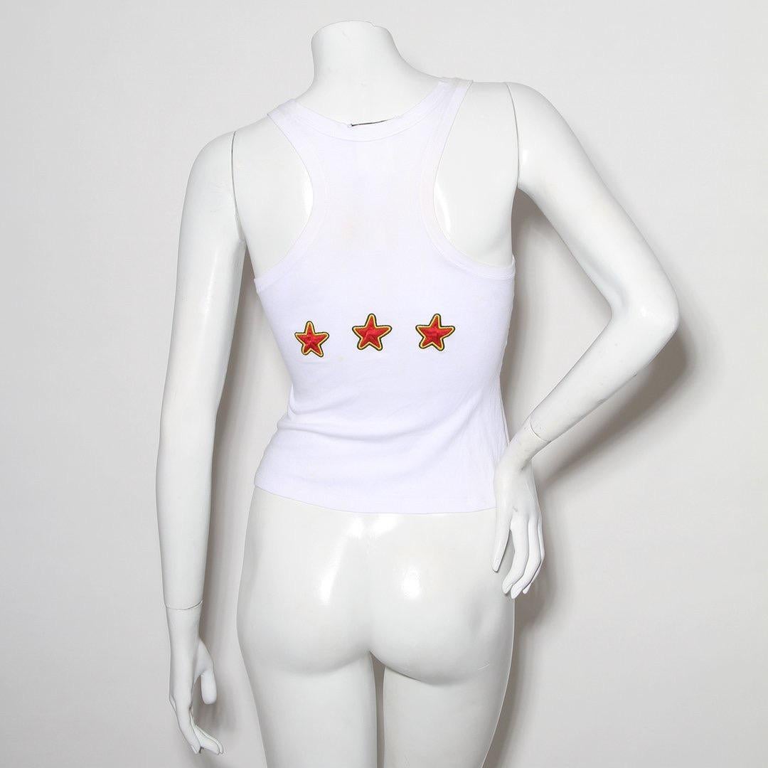 From John Galliano’s spring summer 2005 RTW collection for the house of Dior. The whimsical take on the anti-war propaganda of the late 1960’s in addition to Galliano’s notorious camp style are highlighted in this particular piece, which graphics
