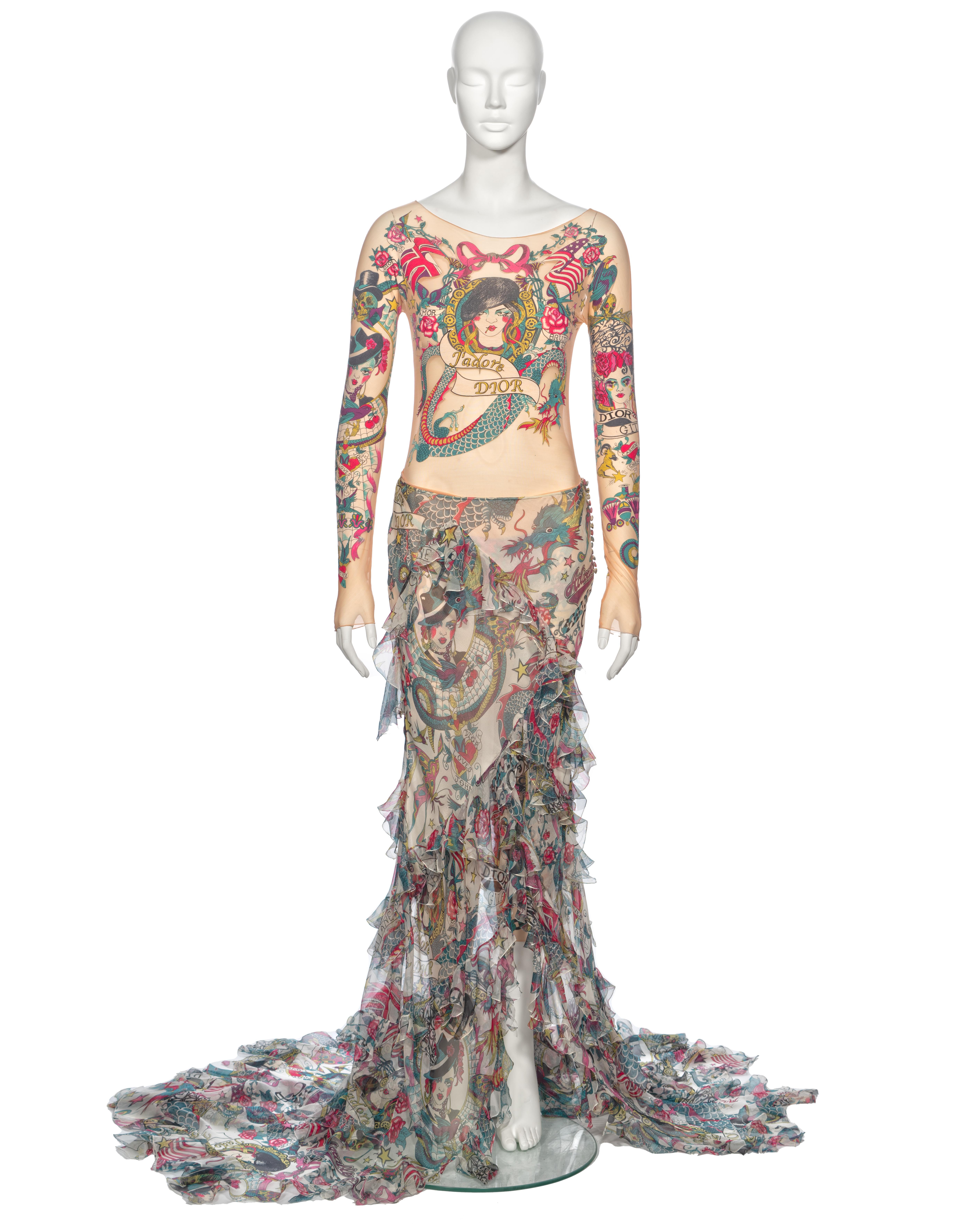 ▪ Archival Christian Dior Tattoo Print Evening Ensemble
▪ Creative Director: John Galliano
▪ Spring-Summer 2004
▪ Sold by One of a Kind Archive
▪ Museum Grade
▪ Allover multicoloured illustrated tattoo motif 
▪ Nude mesh long sleeve bodysuit
▪ Nude
