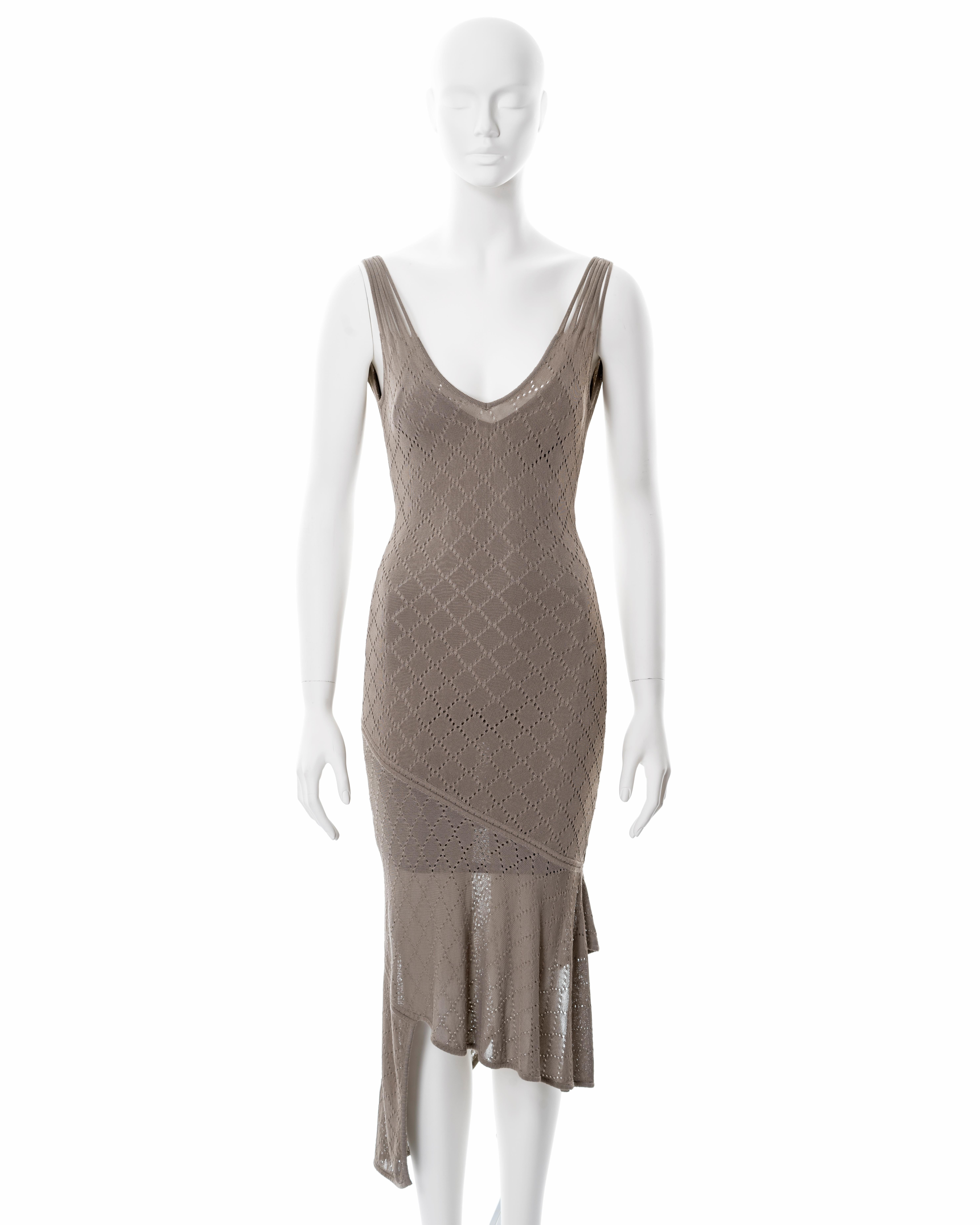 ▪ Christian Dior taupe open-knit dress
▪ Designed by John Galliano
▪ Sold by One of a Kind Archive
▪ Spring-Summer 2001
▪ Double-layered 
▪ Multiple shoulder straps 
▪ Figure-hugging fit 
▪ Deep v neckline 
▪ Asymmetric hemline 
▪ Size Small

All