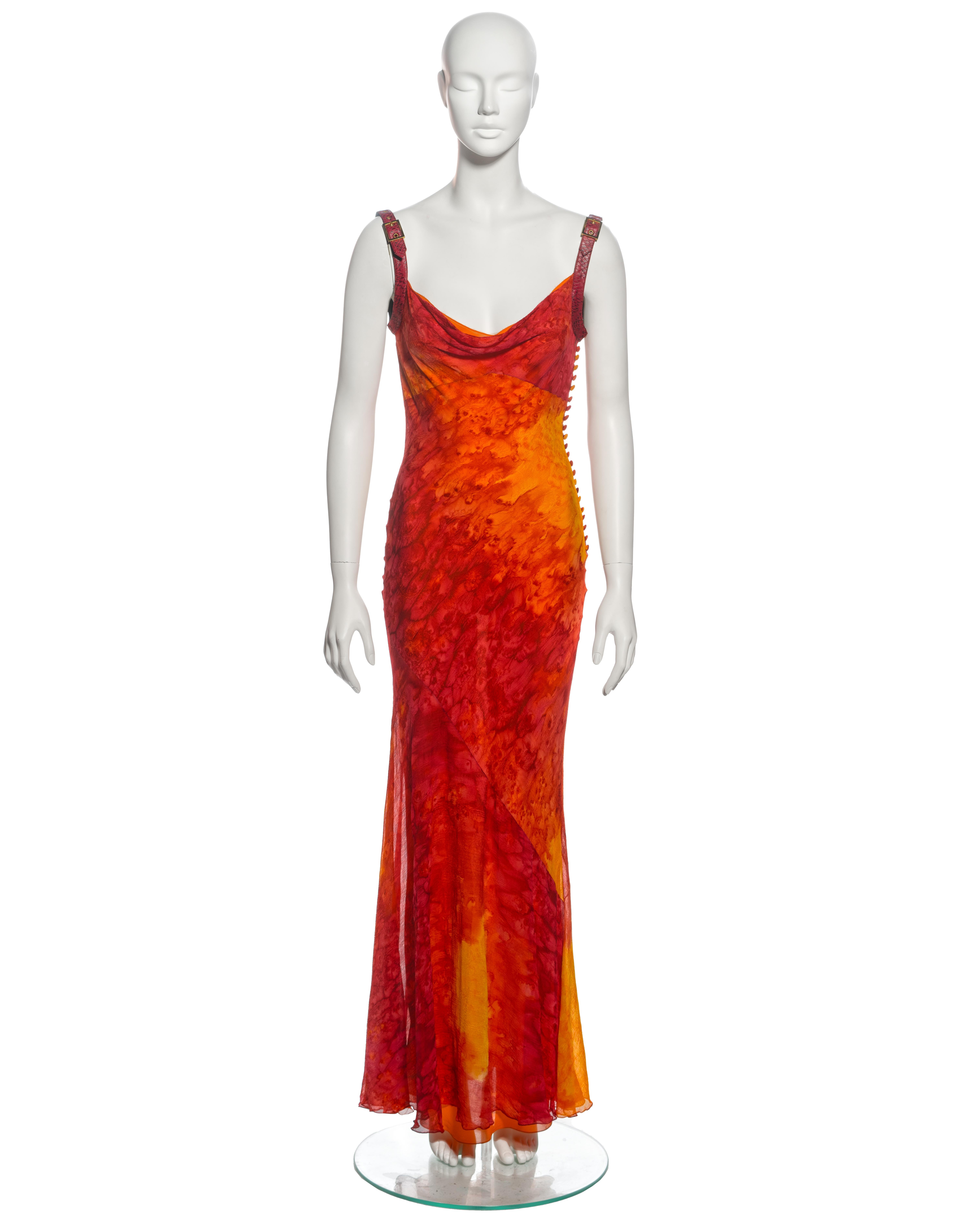 ▪ Archival Christian Dior Evening Dress
▪ Creative Director: John Galliano
▪ Spring-Summer 2001
▪ Crafted from luxurious bias-cut silk chiffon, embellished with a captivating tie-dye print in vibrant saffron, orange, and crimson hues
▪ Adjustable