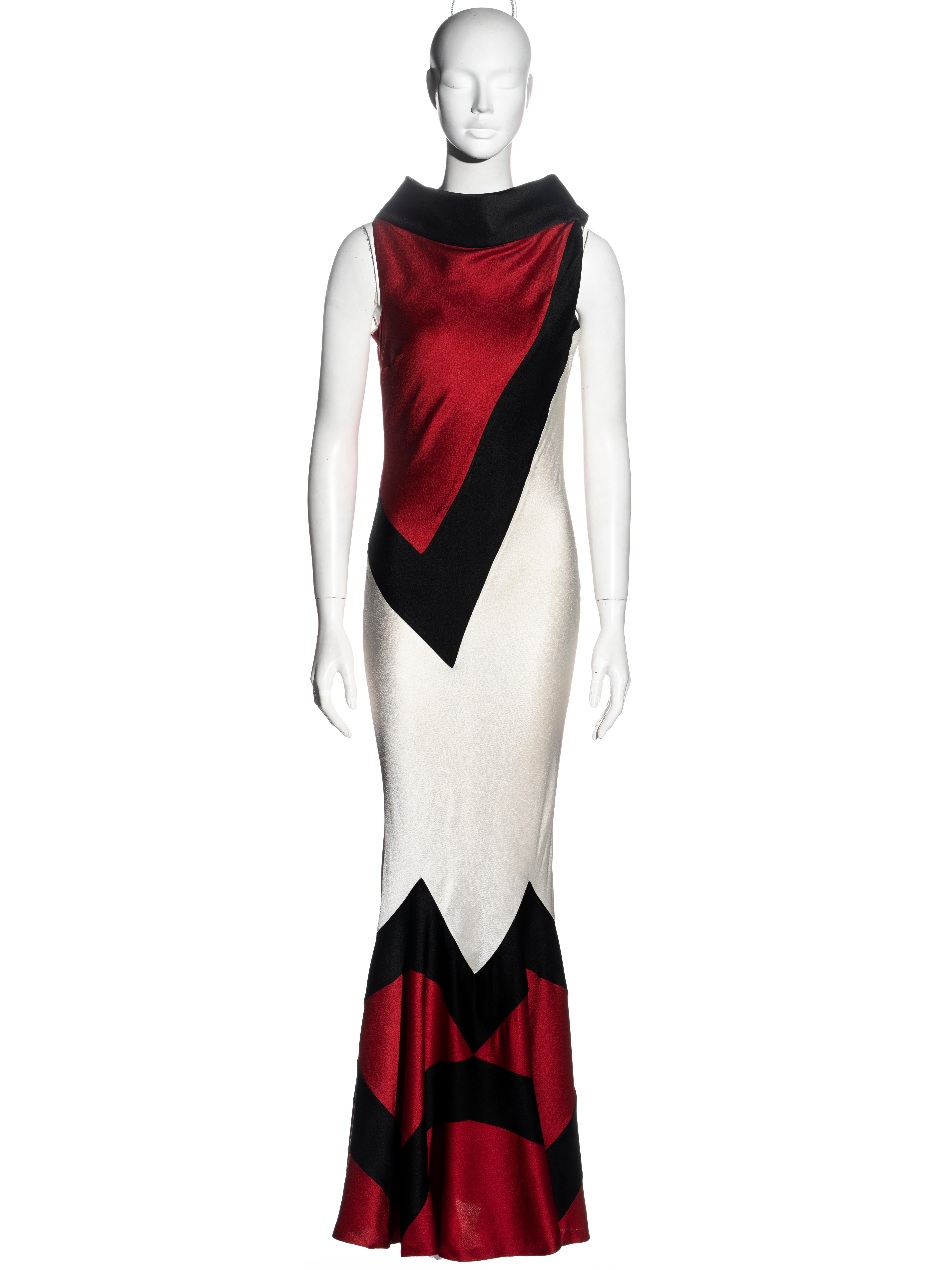 ▪ Christian Dior tricolour evening dress
▪ Designed by John Galliano
▪ Made up of red, black and ivory viscose panels 
▪ Standing collar 
▪ Floor-length fishtail skirt
▪ Silk lining 
▪ FR 38 - UK 10 - US 6
▪ Spring-Summer 1999
▪ 56% Viscose, 44%