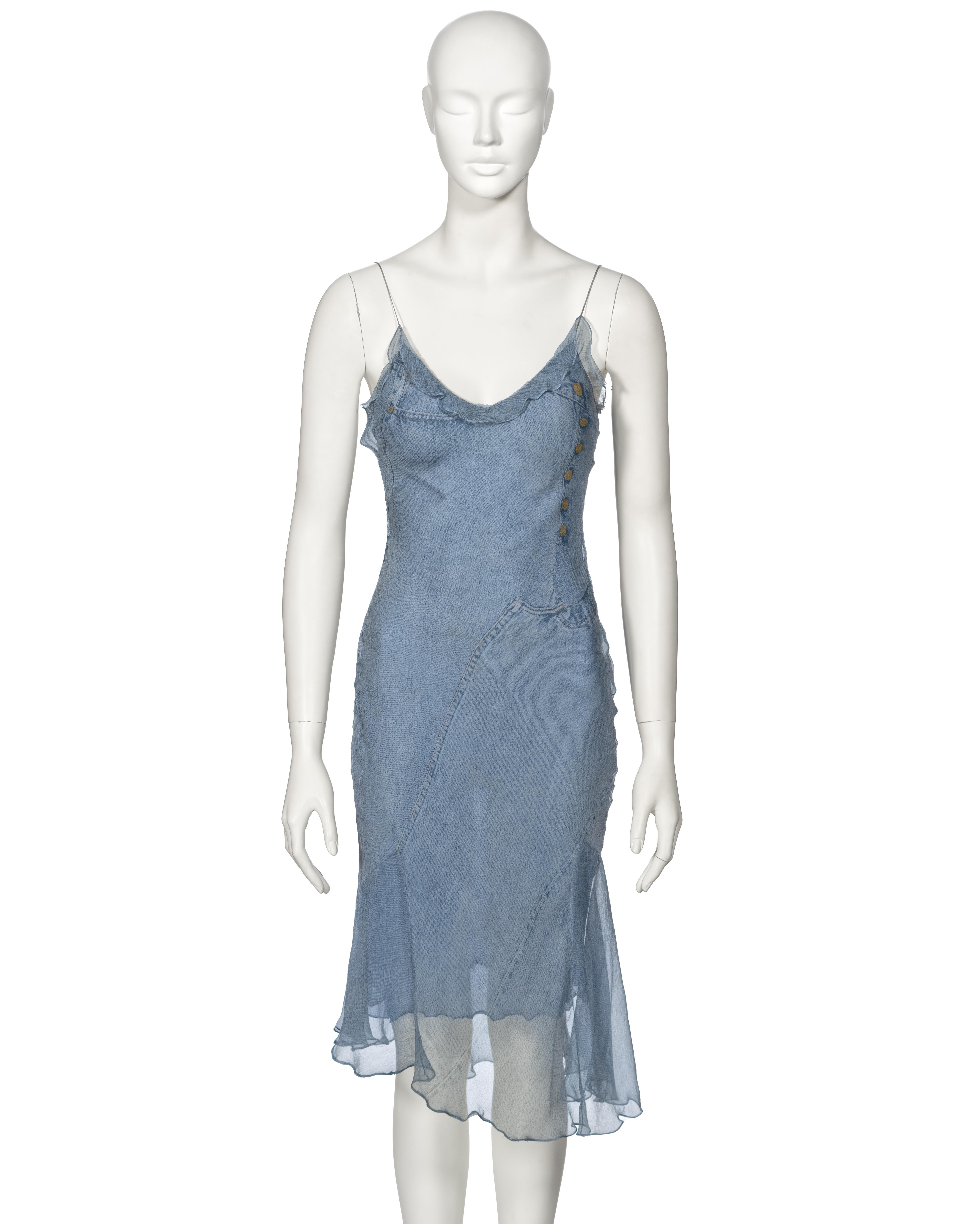 ▪ Archival Christian Dior Dress
▪ Creative Director: John Galliano
▪ Spring-Summer 2000
▪ Sold by One of a Kind Archive
▪ Constructed from two layers of bias-cut silk 
▪ Features an allover trompe l'oeil print resembling blue denim jeans 
▪ Ruffled