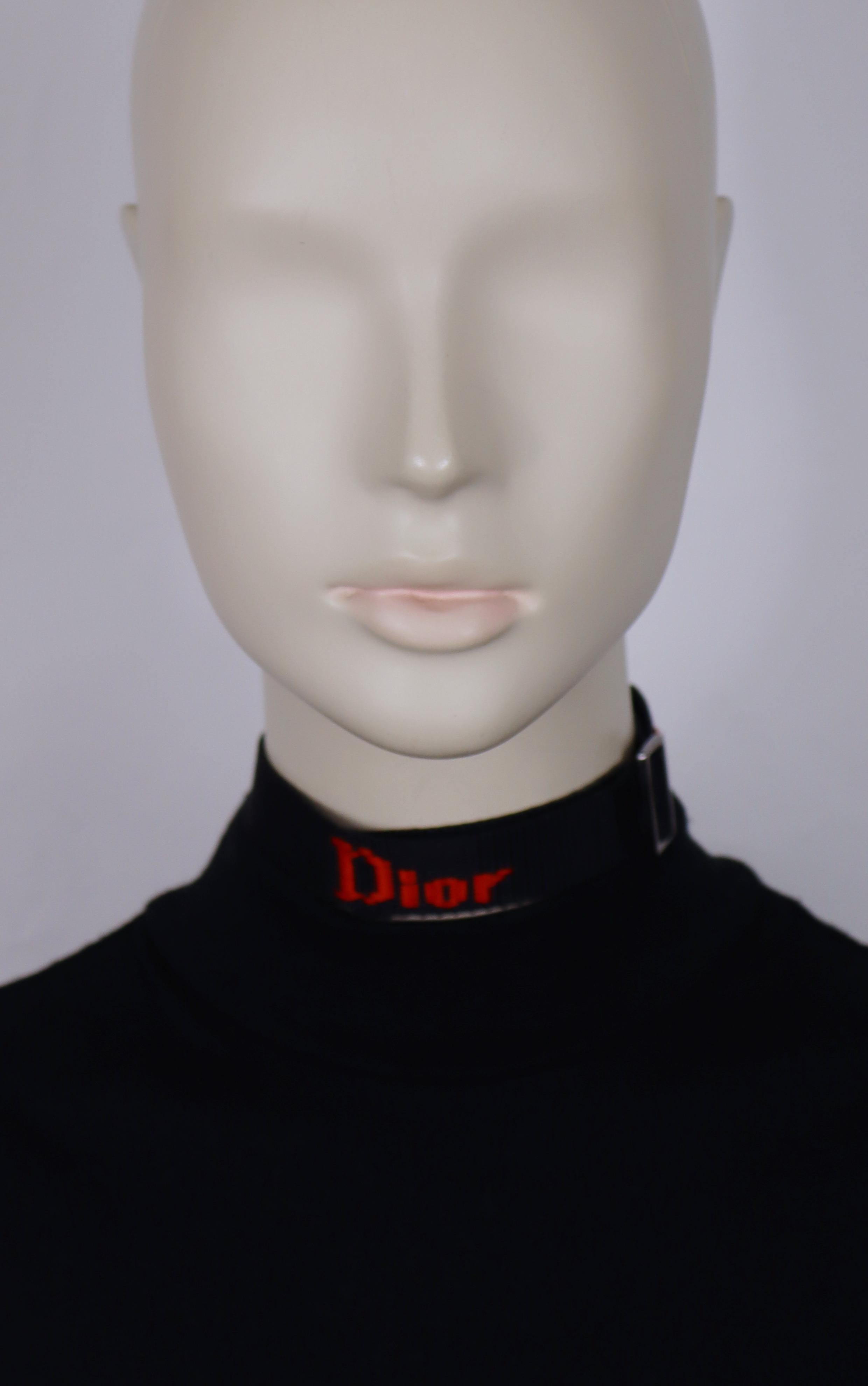 CHRISTIAN DIOR by JOHN GALLIANO vintage black nylon strap choker necklace featuring red DIOR logos.

Adjustable length.

Lobster clasp closure.

Embossed CD on the clasp.

Indicative measurements : max. circumference approx. 36.13 cm (14.22 inches)