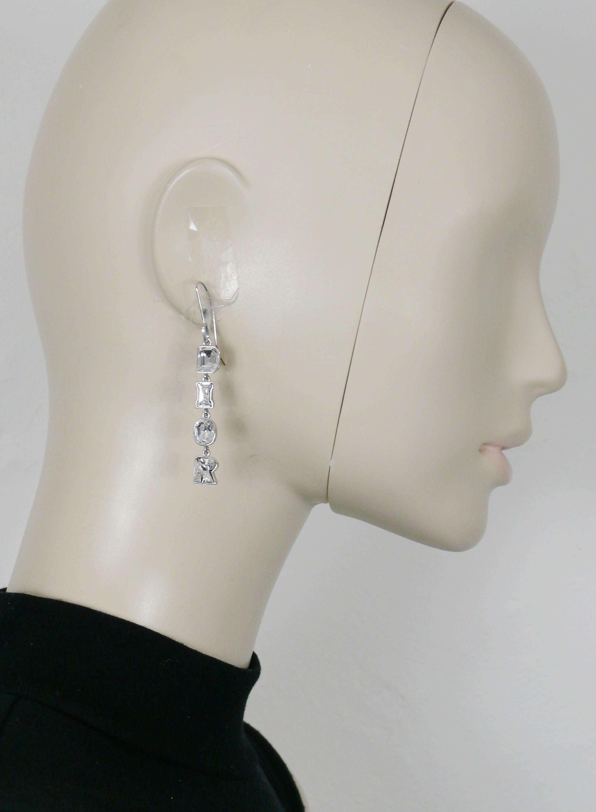 CHRISTIAN DIOR vintage silver tone dangling earrings (for pierced ears) featuring a clear crystal D I O R logo.

Unmarked (usual for this model).

Indicative measurements : height approx. 6.3 cm (2.48 inches) / max. width approx. 0.7 cm (0.28