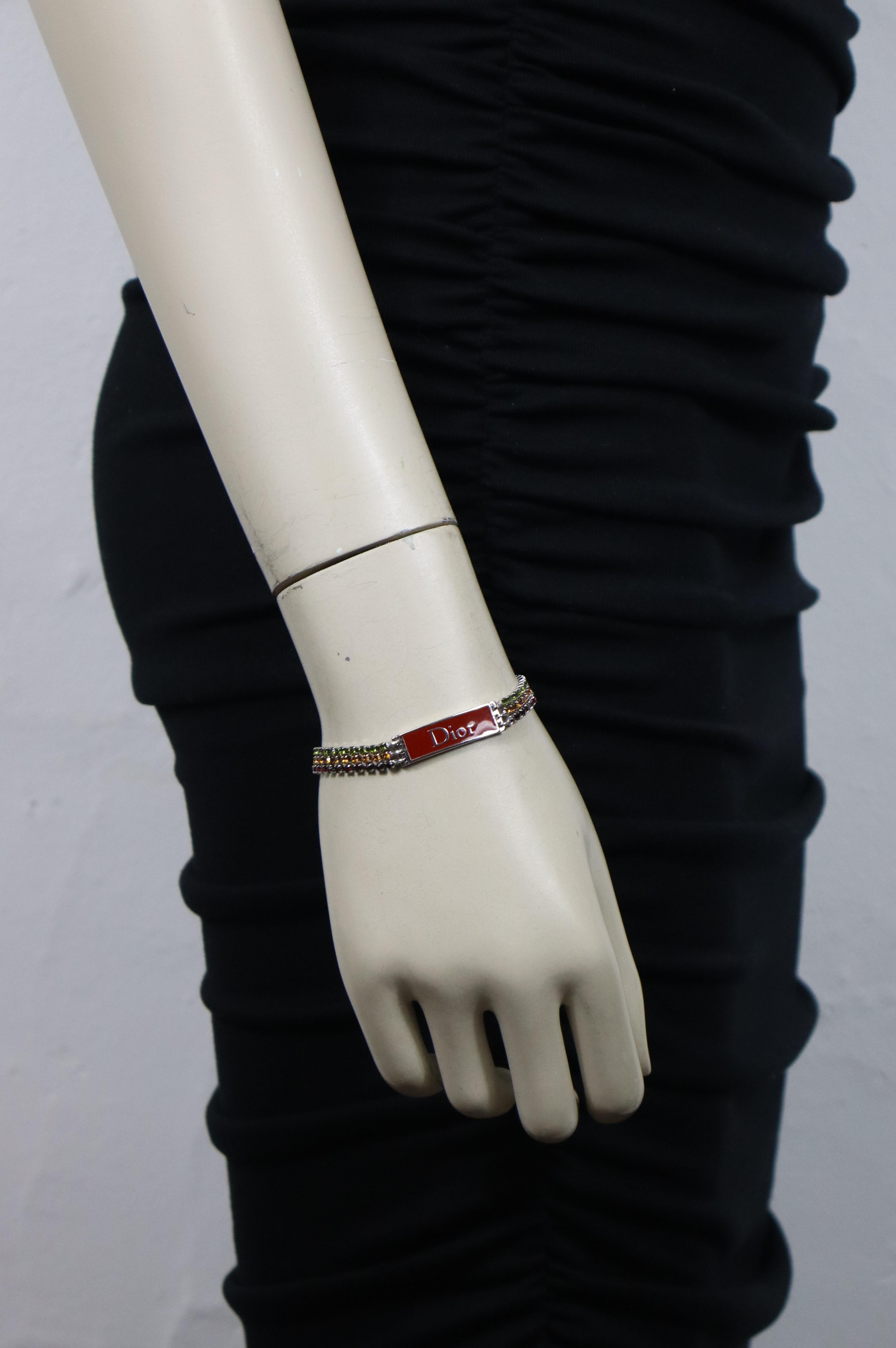 CHRISTIAN DIOR by JOHN GALLIANO vintage silver tone rasta bracelet embellished with multicolored crystals.

Embossed DIOR.

Indicative measurements : adjustable length from approx. 17 cm (6.69 inches) to approx. 22 cm (8.66  inches) / max. width