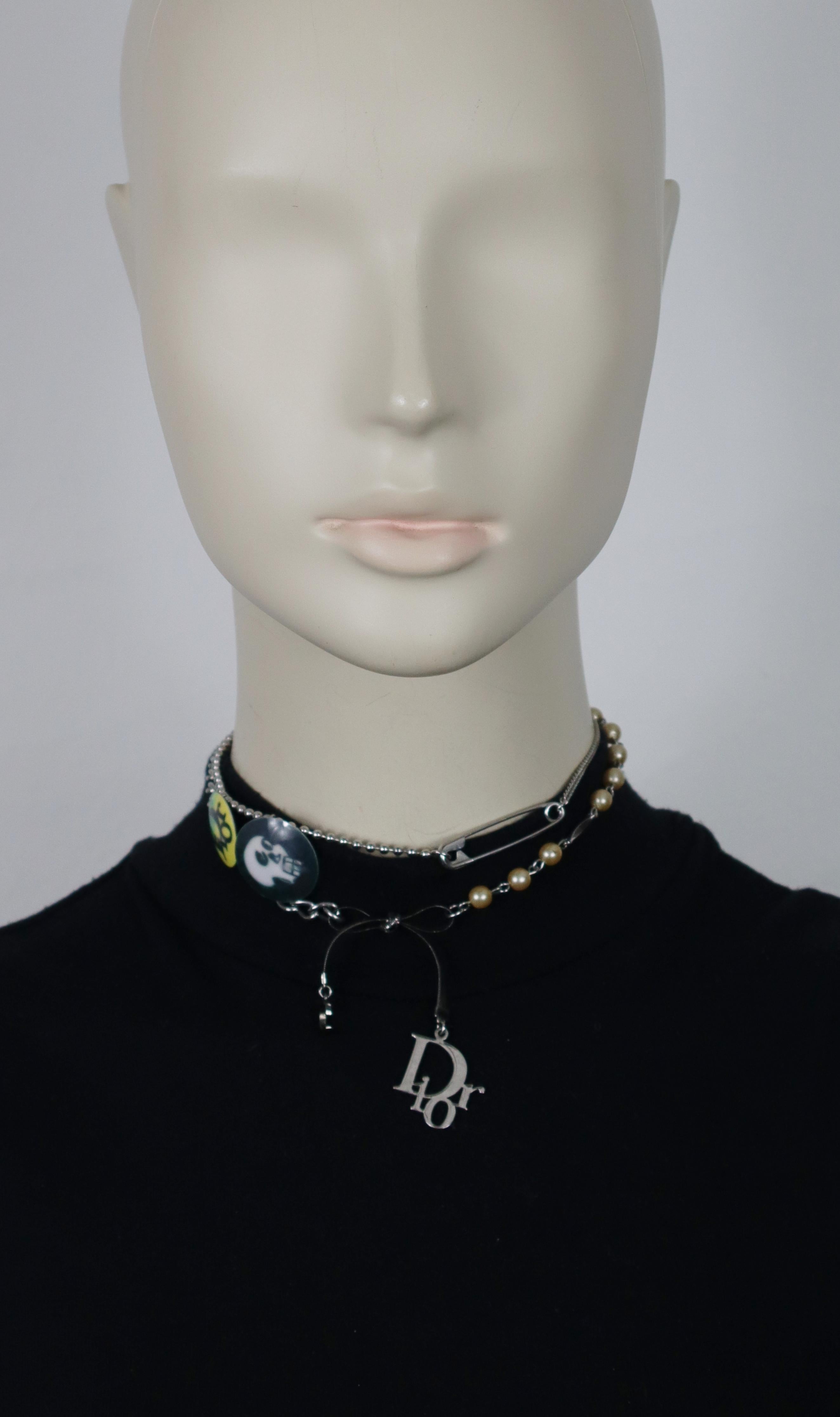 CHRISTIAN DIOR by JOHN GALLIANO vintage silver tone chain necklace featuring a printed skull and DIOR logo medallions, safety pin, bow with letter C and DIOR logo charms, faux pearls.

Adjustable hook clasp.

Embossed DIOR.

Indicative measurements