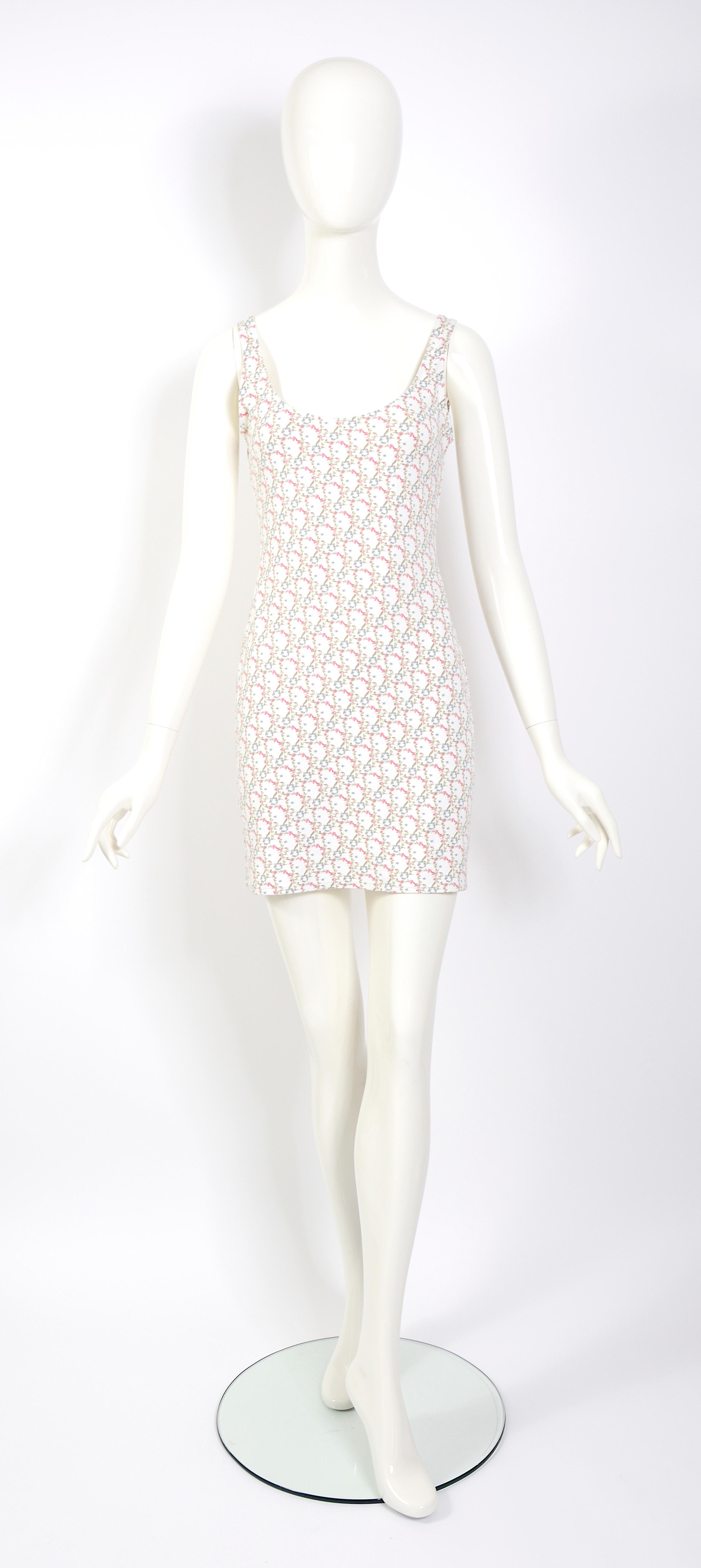 This charming vintage dress from Christian Dior's John Galliano boutique S/S 2005 features a flower monogram print on comfortable cotton stretch fabric. 
The dress does not have a size label, but based on our measurements, it likely fits a French