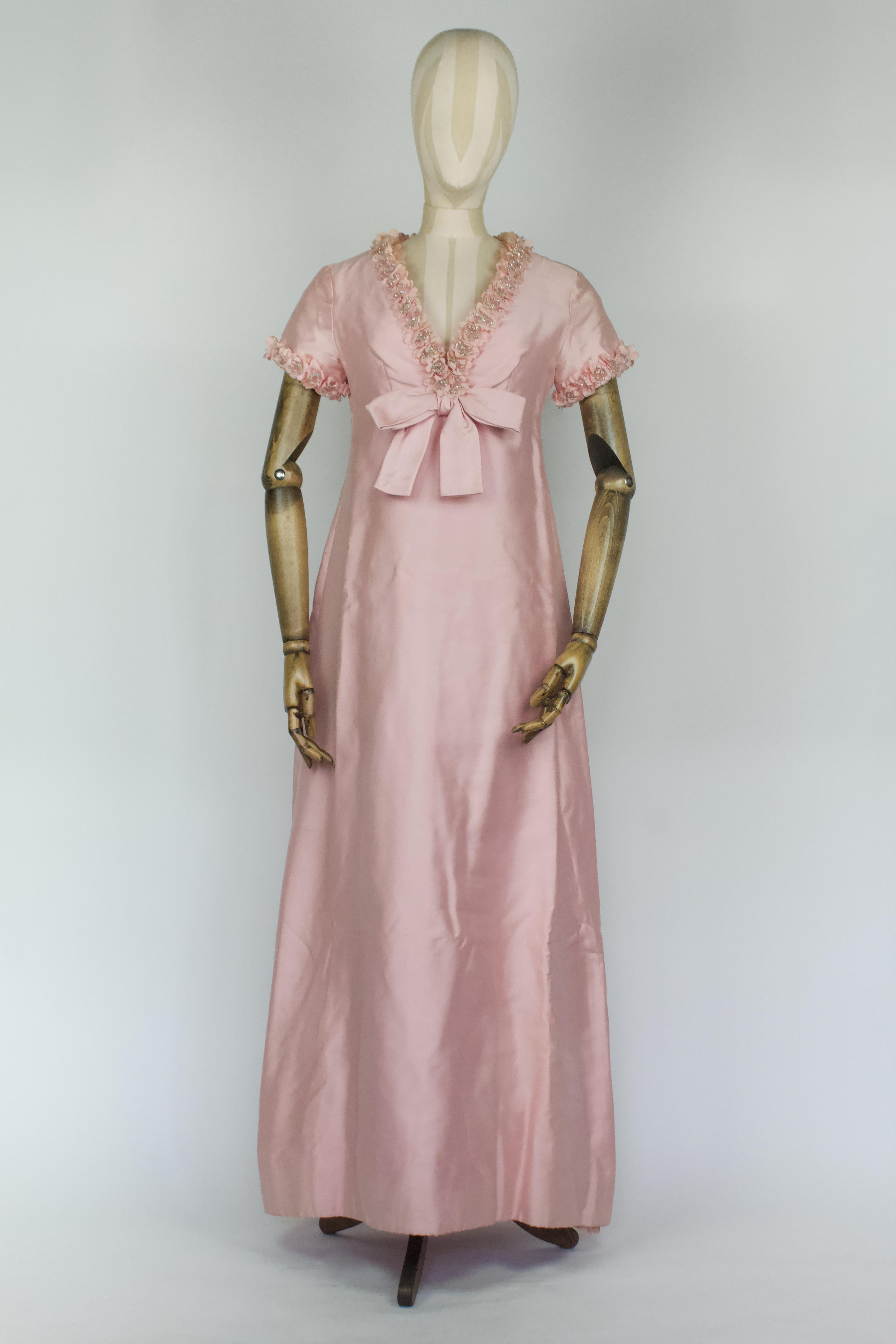 Christian Dior by Marc Bohan dress, circa mid 1960s/very early 1970s. Pink silk with floral crystal embellishments and large bow to front. An exquisite piece of Dior history. Sample labelled. Numbered. 

Condition
In good condition for age, a