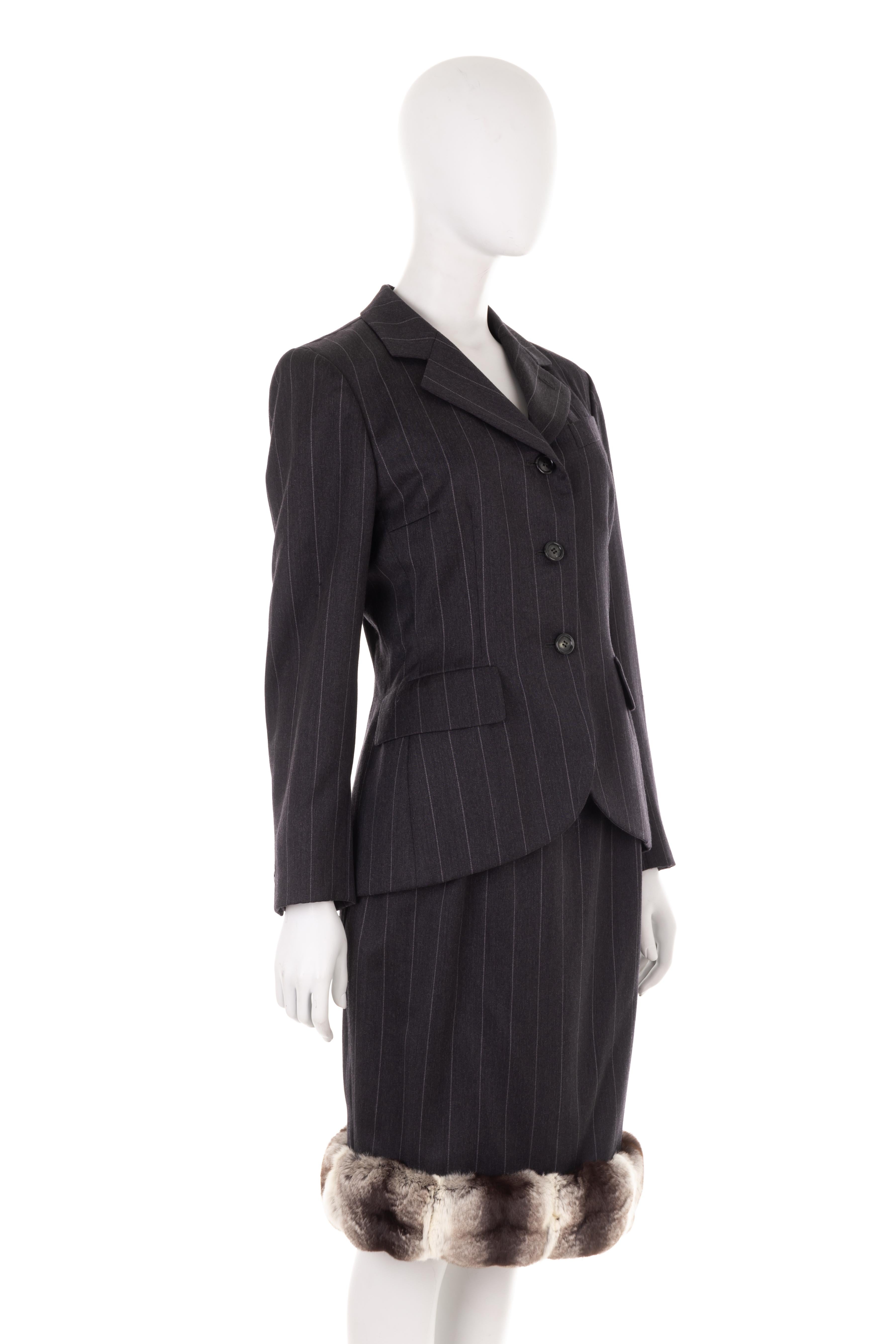- Christian Dior by Marc Bohan
- Fall Winter 1987 collection
- Grey wool pinstripe jacket and skirt suit
- Form-fitting hourglass tailored jacket
- Wide notch lapels
- Front flap pockets
- Front horn buttons
- Midi pinstripe skirt 
- Brown