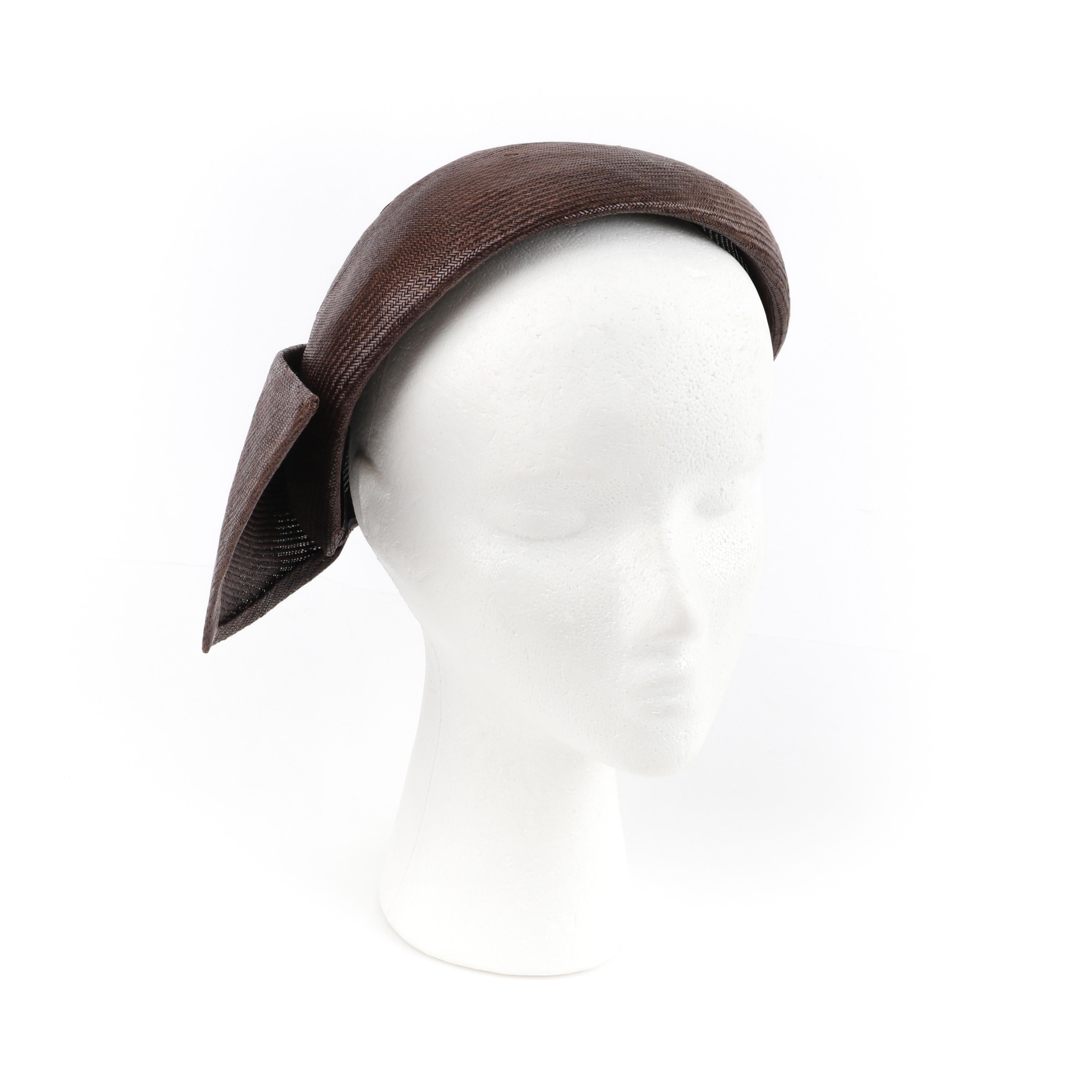 CHRISTIAN DIOR c.1950s Brown Woven Straw Sweeping Knife Pleat Crown Cap Hat
 
Circa: 1950’s
Label(s): Christian Dior New York Original
Designer: Christian Dior
Style: Half hat / crown cap
Color(s): Shades of warm brown (exterior, interior)
Lined:
