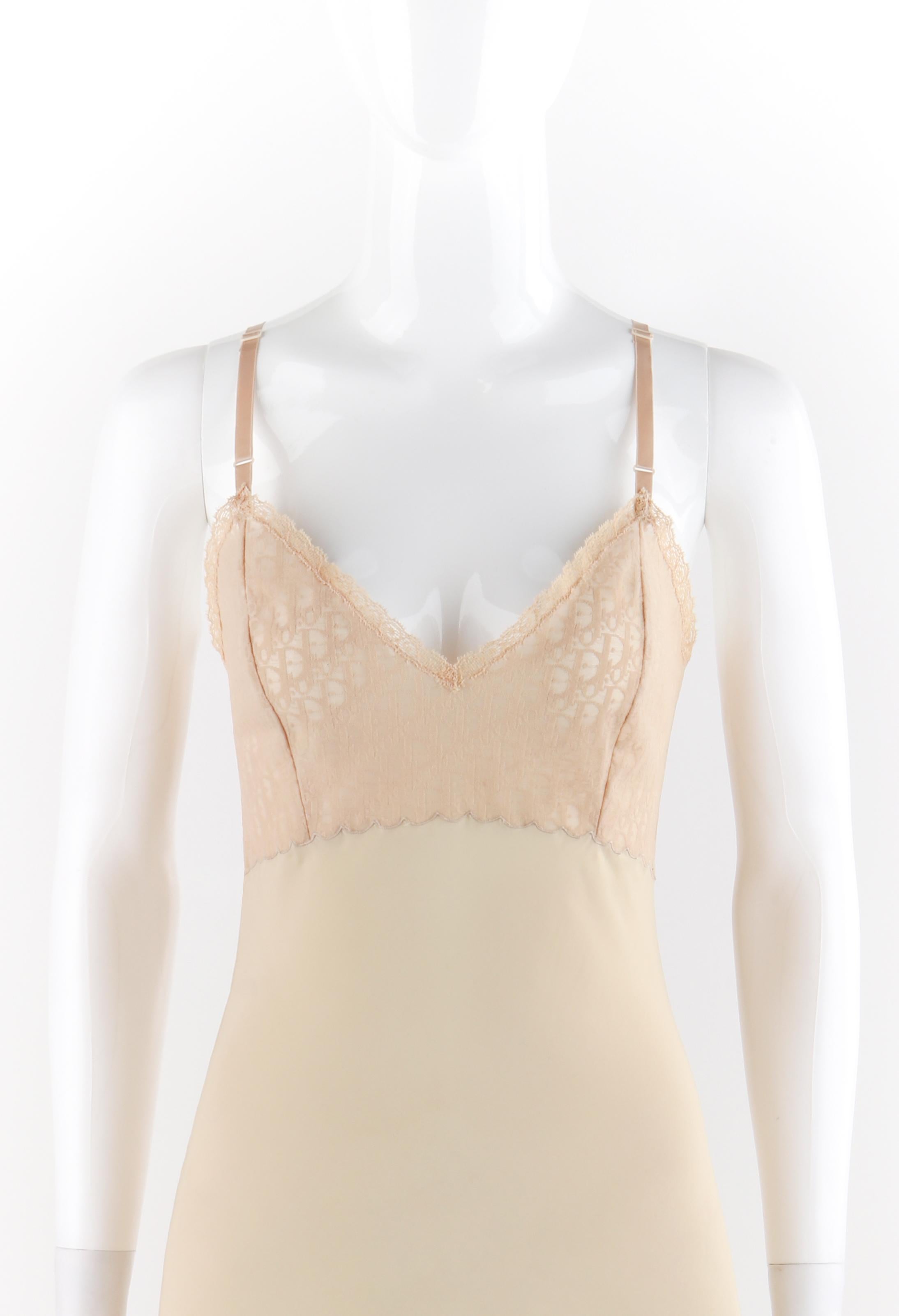CHRISTIAN DIOR c.1970’s Nude Semi Sheer Signature Print Mesh Lace Panel Slip Dress
Circa: 1970’s
Label(s): Christian Dior Lingerie
Designer: Marc Bohan
Style: Slip
Color(s): Shades of Nude / Peach
Lined: No
Marked Fabric Content: “45% Nylon, 30%