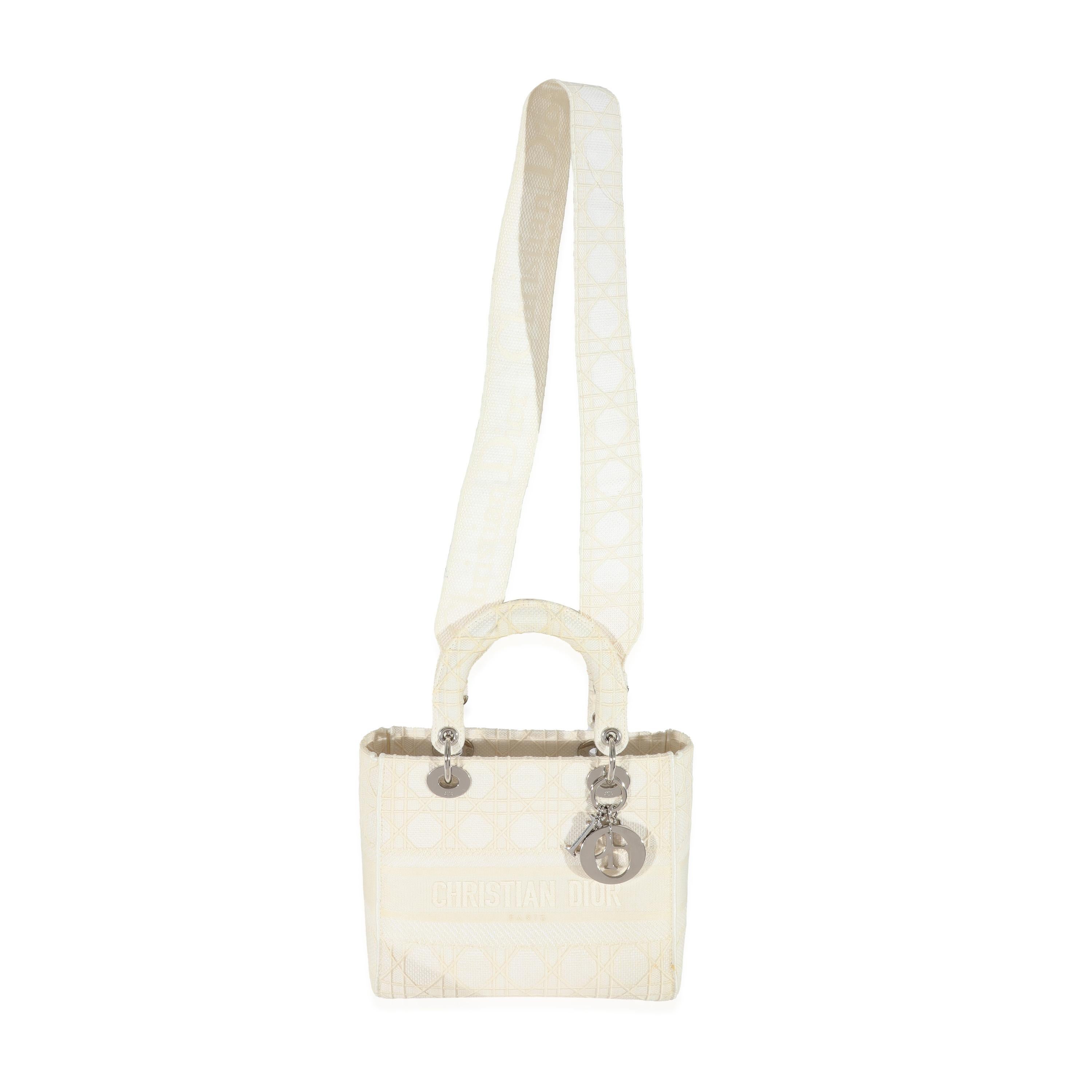 Listing Title: Christian Dior Cannage White Canvas D-Lite Lady Dior
SKU: 129693
Condition: Pre-owned 
Handbag Condition: Very Good
Condition Comments: Very Good Condition. Marks and discoloration to exterior. Scratching to hardware. Marks to
