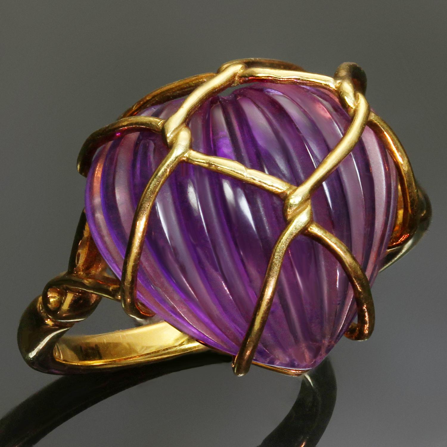 This fabulous and rare Christian Dior ring is crafted in 18k yellow gold features a delicately carved cabochon amethyst heart uniquely set in a knotted wire frame design. Made in France circa 1980s. Measurements: 0.51